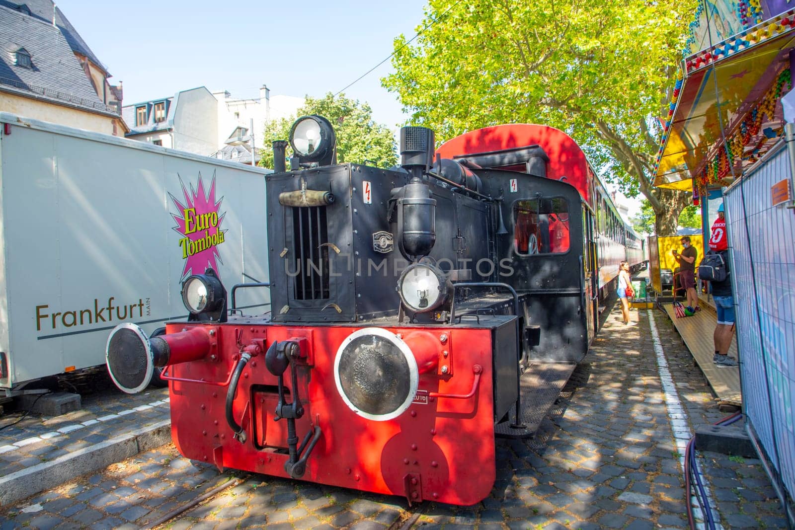 Frankfurt, Germany - July 18, 2021: old historic train operates in the Nizza area, the Main river promenade in Frankfurt.