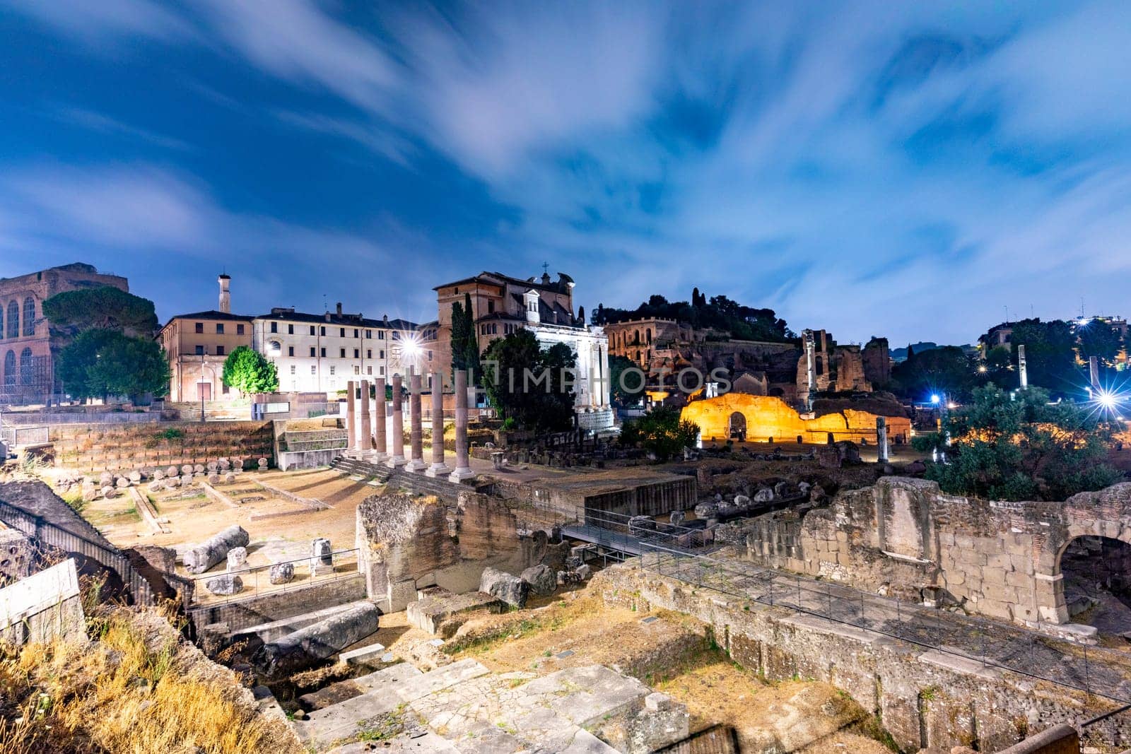 Rome, Italy - August 4, 2021: night view of the roman forum with archaeolocial site in Rome, Italy