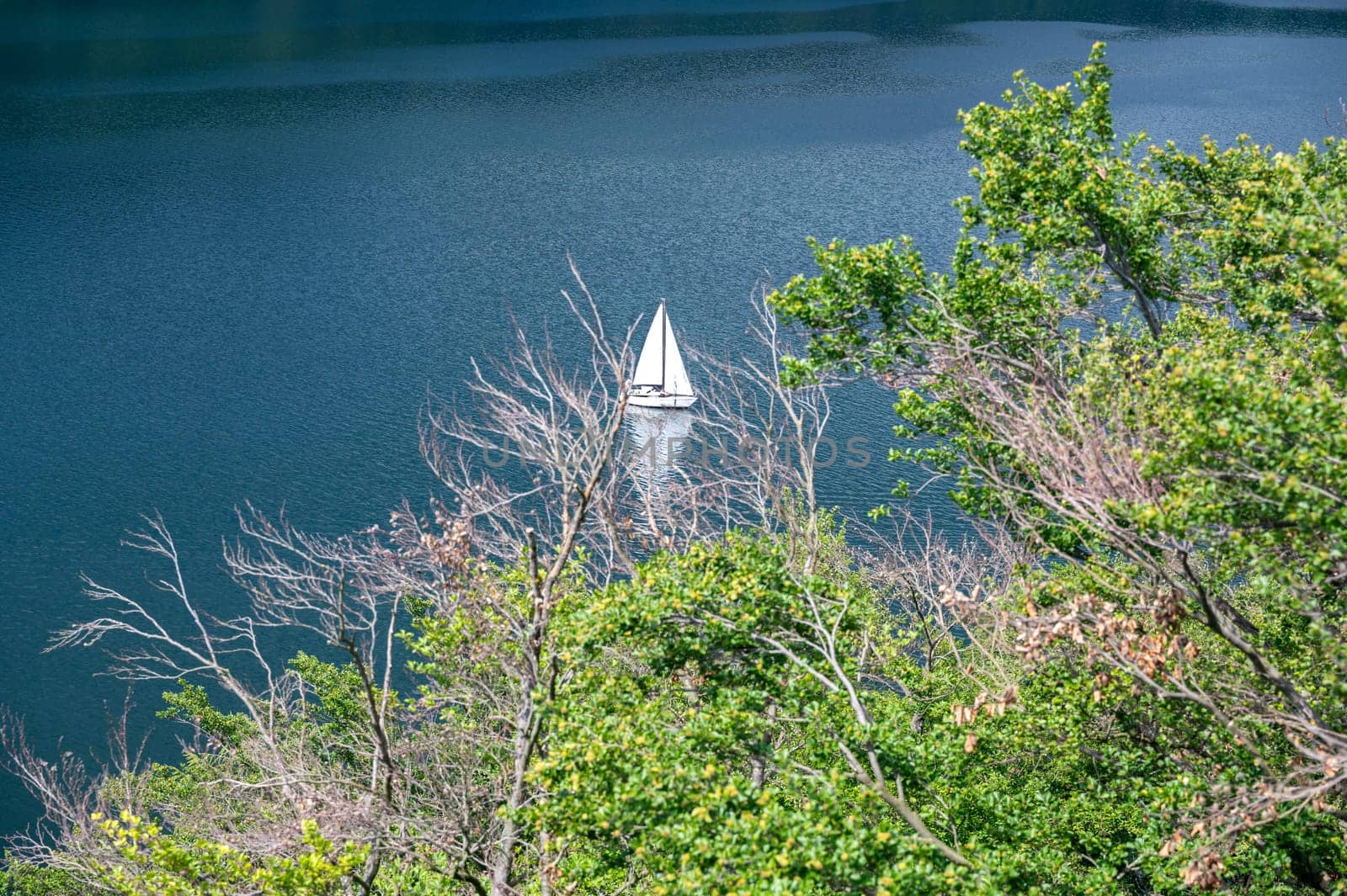 View of the Lake Eder with sky, sailboat and clouds, Hesse, Germany