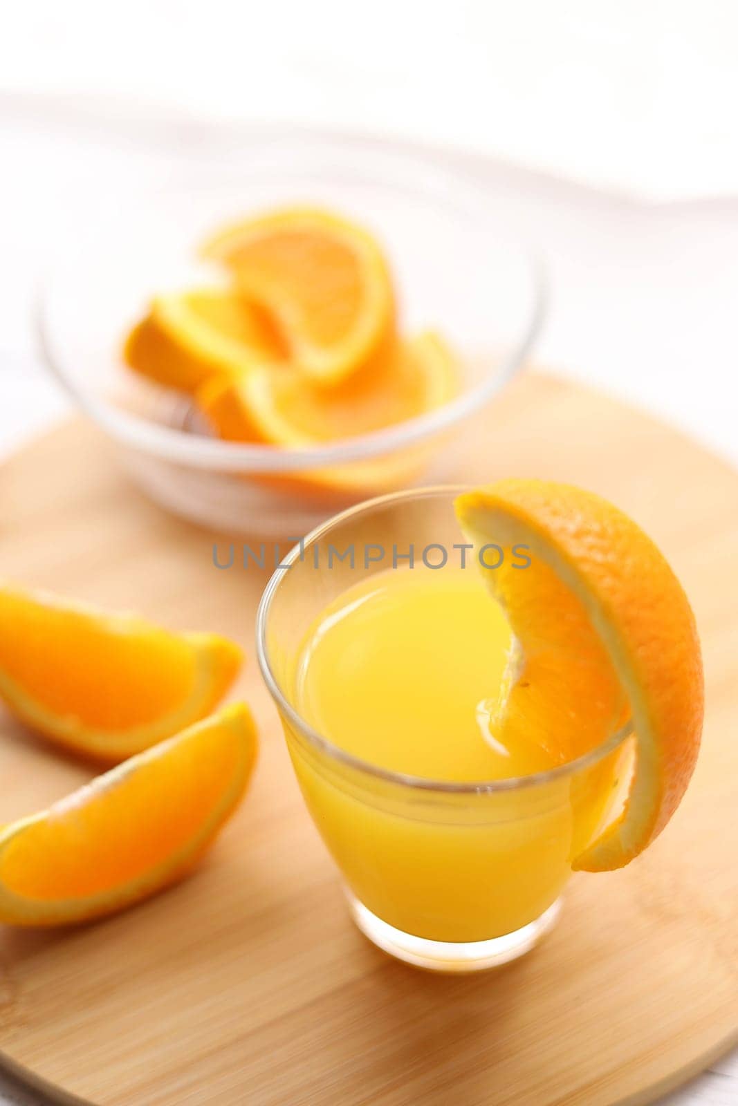 Fresh oranges and a glass of orange juice