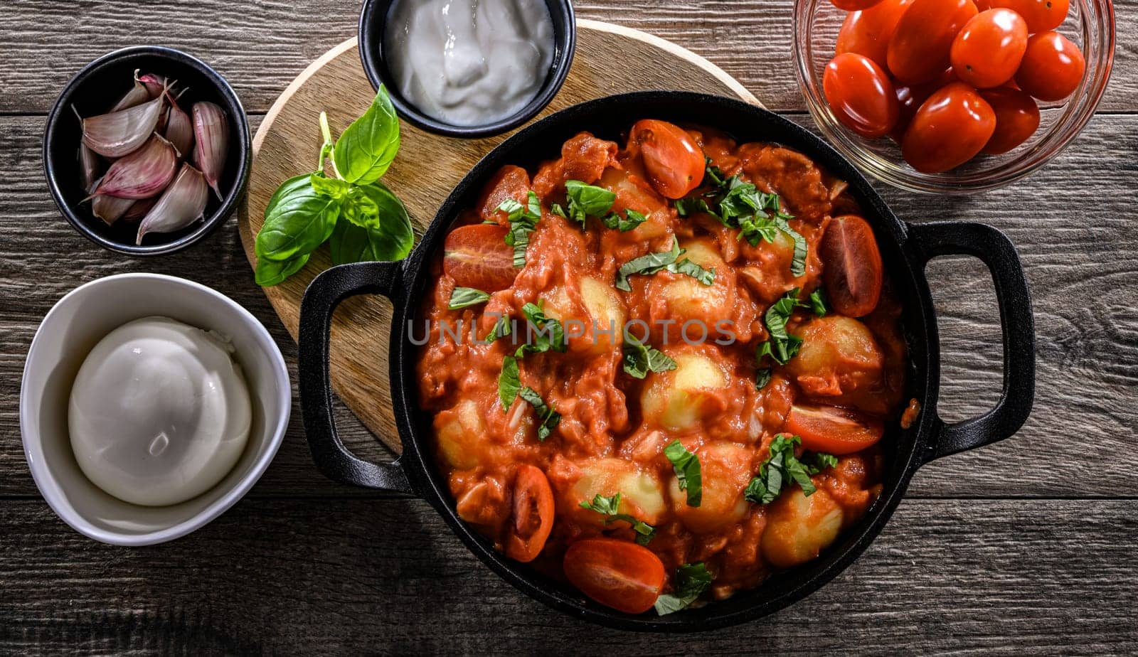 Creamy tomato gnocchi with burrata, basil and garlic.