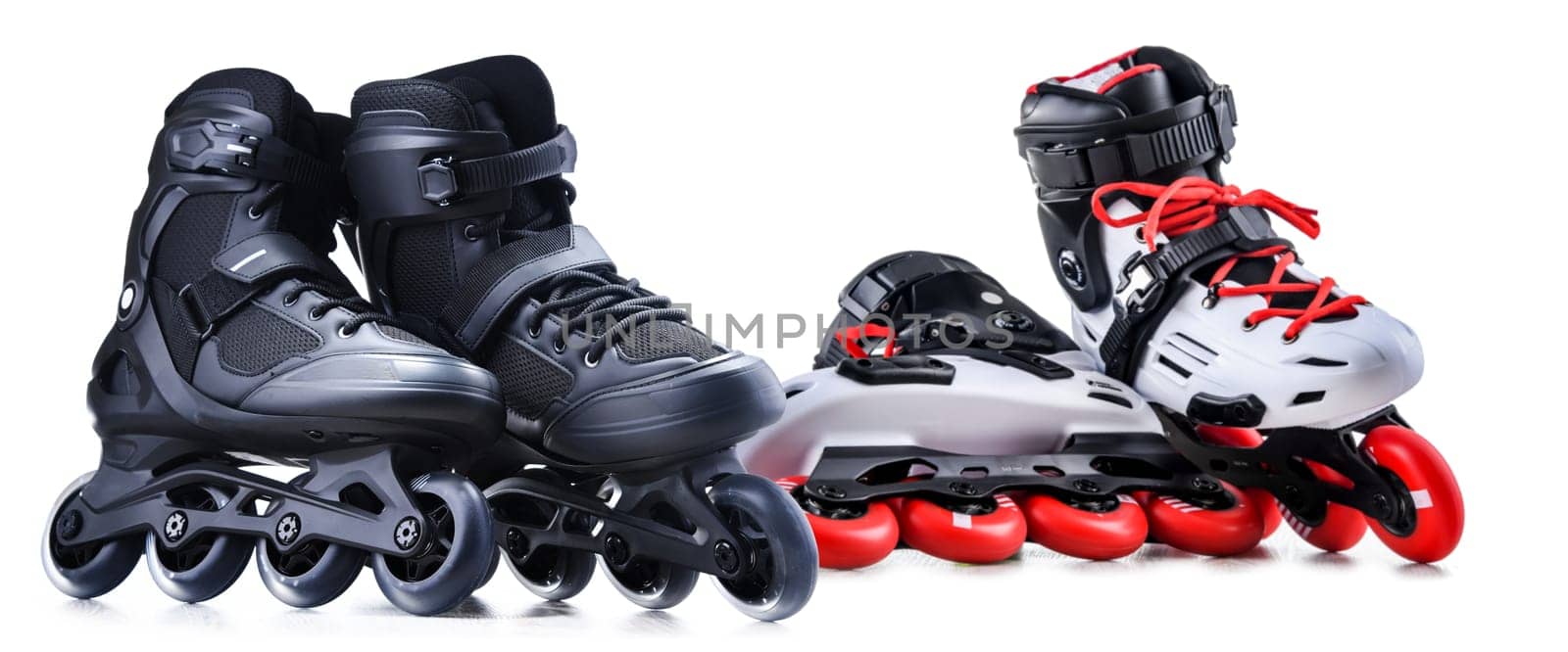 Two pairs of inline skates isolated on white background.