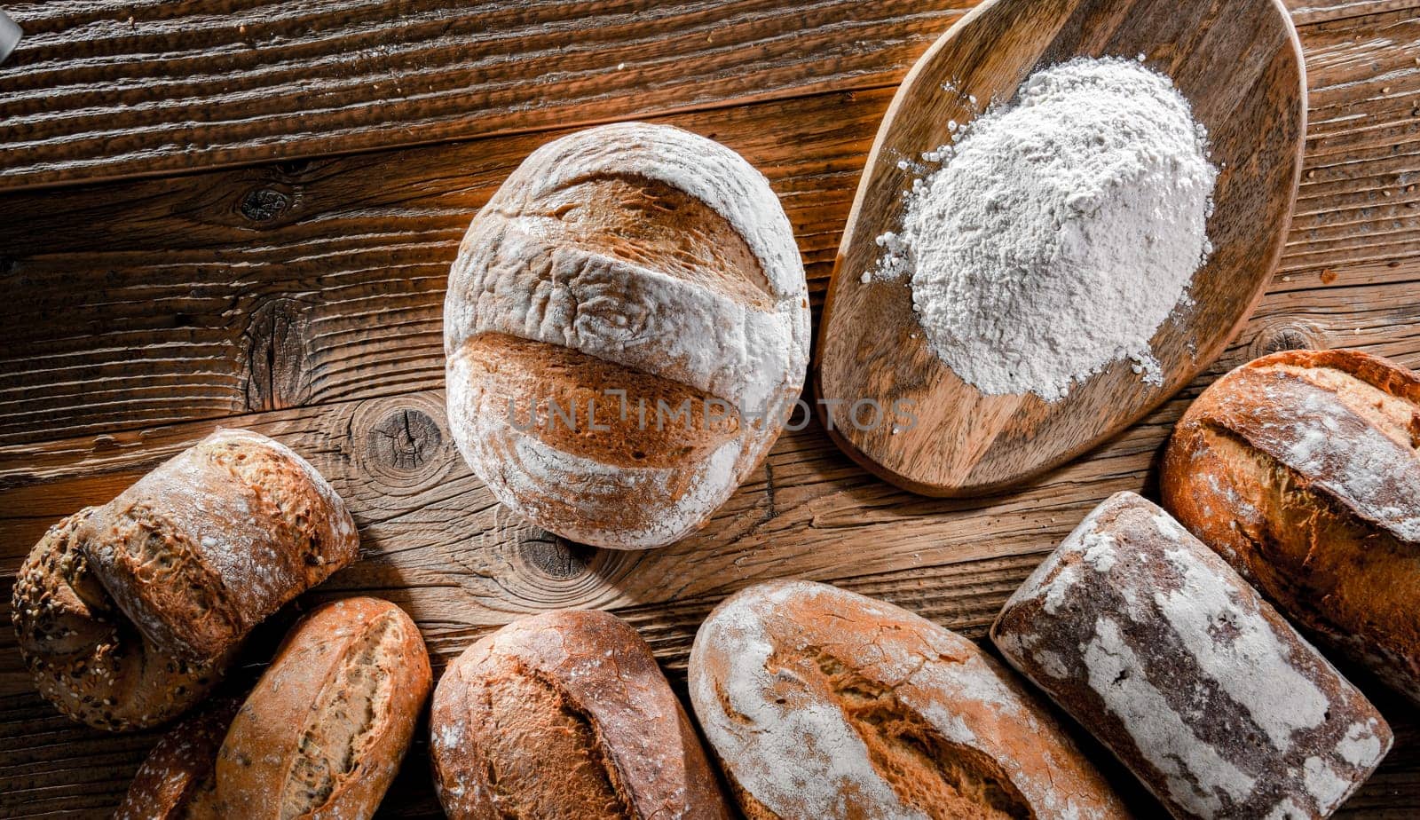 Composition with assorted bakery products on wooden table.
