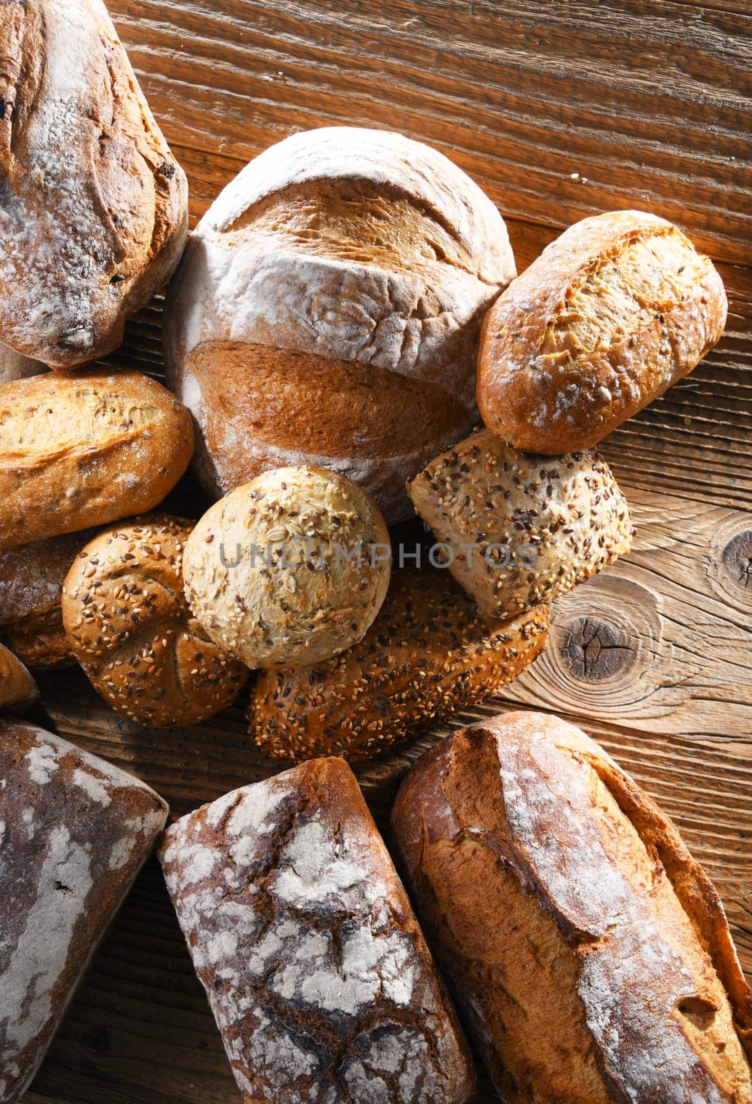 Composition with assorted bakery products on wooden table.