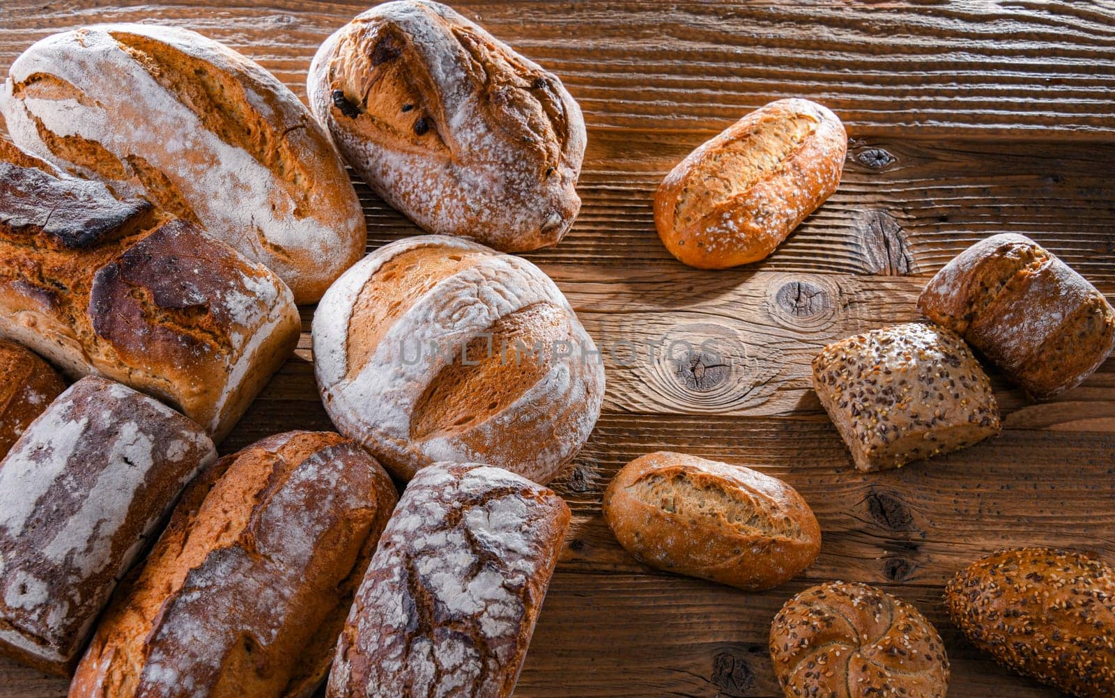 Composition with assorted bakery products on wooden table.