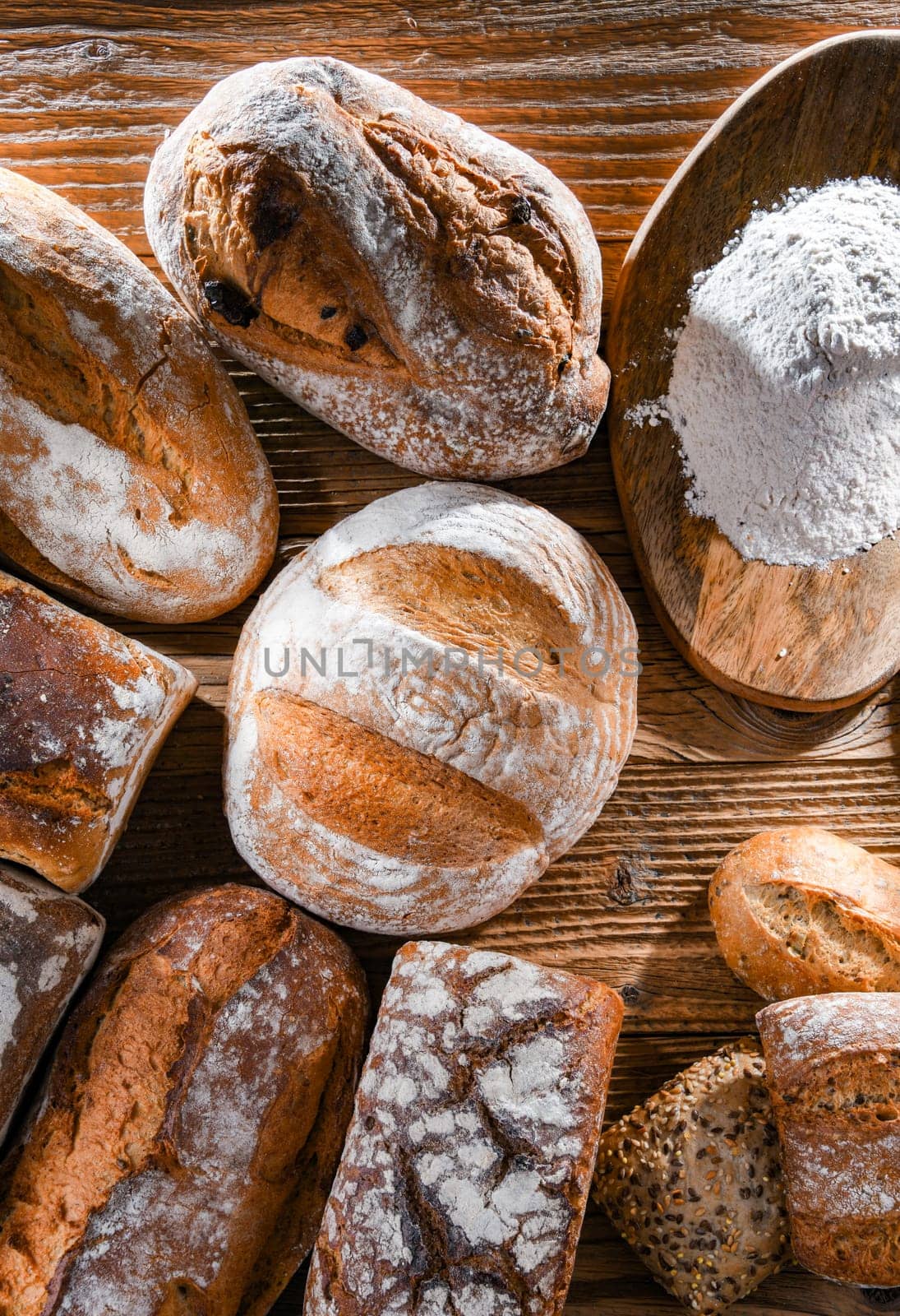 Composition with assorted bakery products on wooden table.