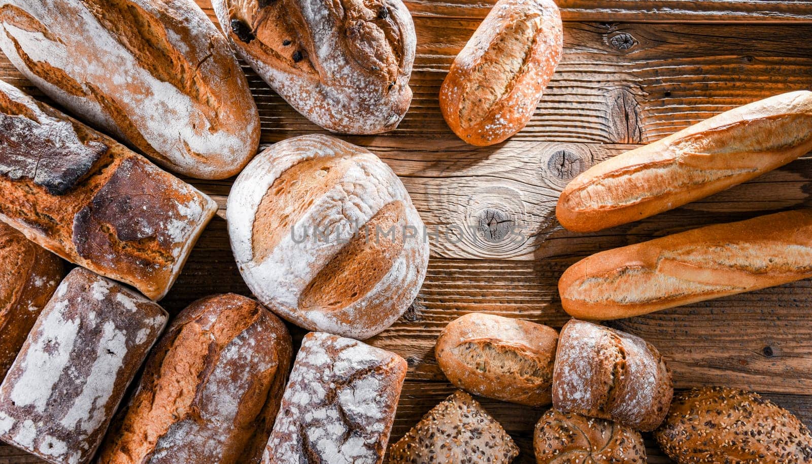 Composition with assorted bakery products on wooden table.