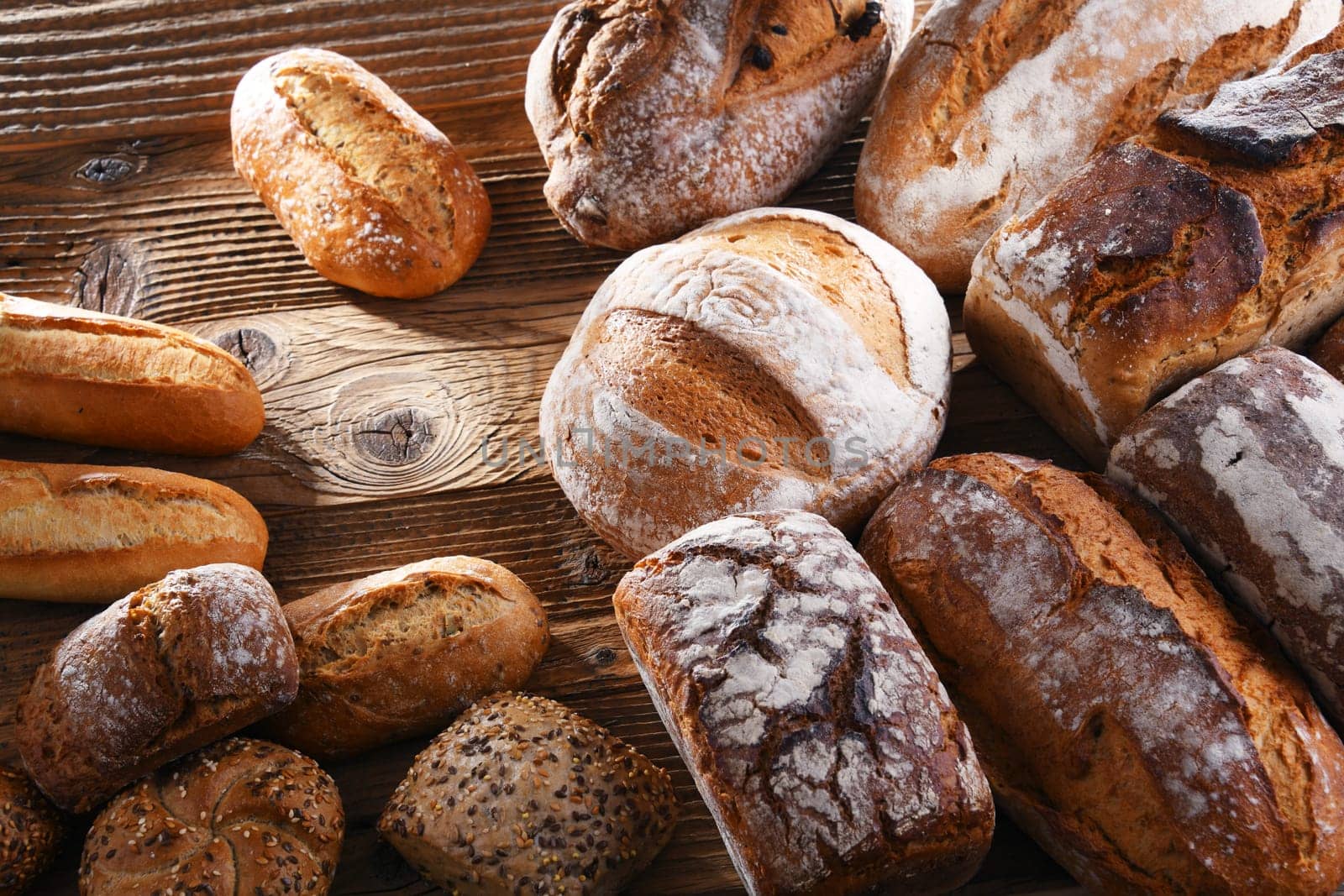 Composition with assorted bakery products on wooden table.