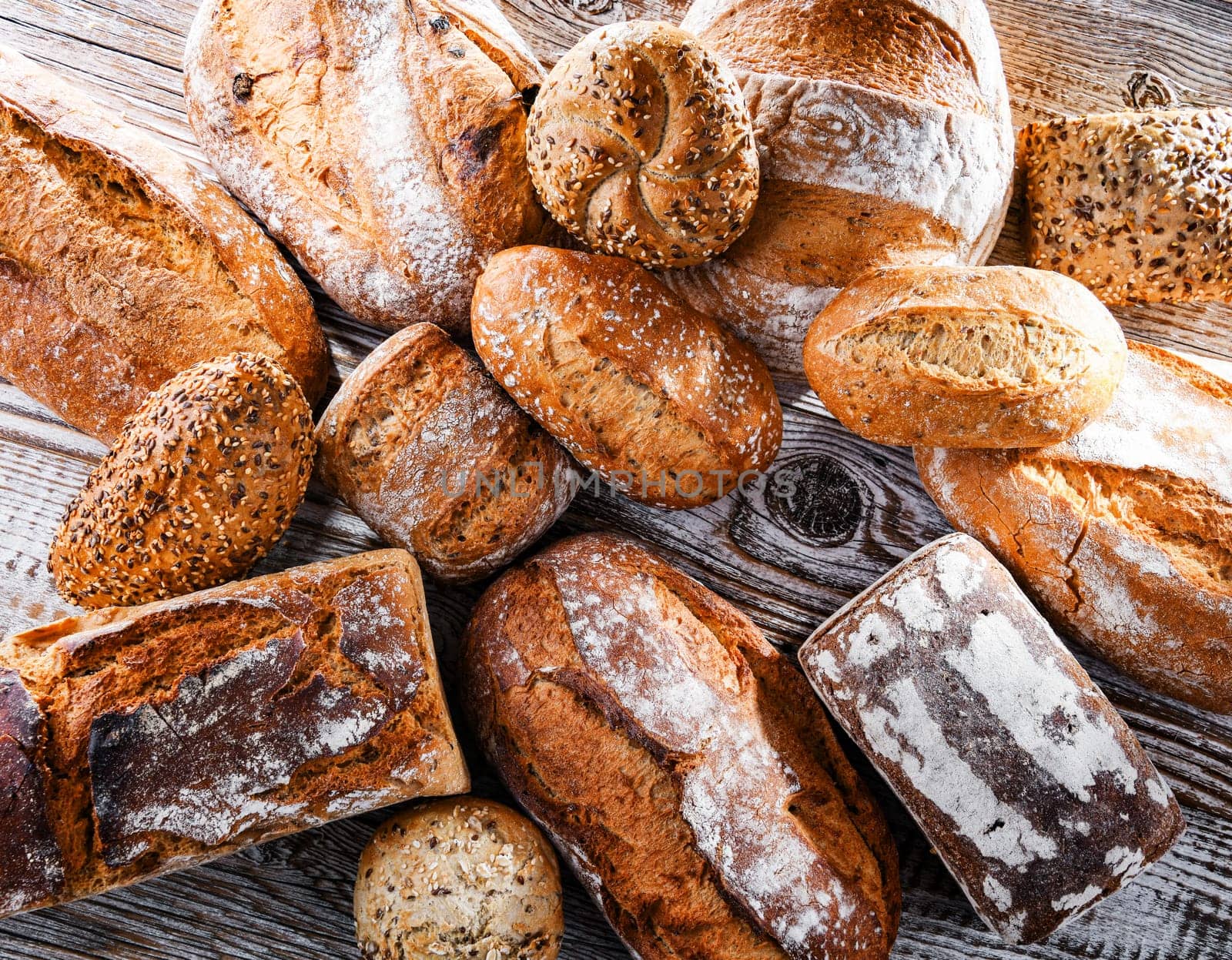 Composition with assorted bakery products on wooden table.