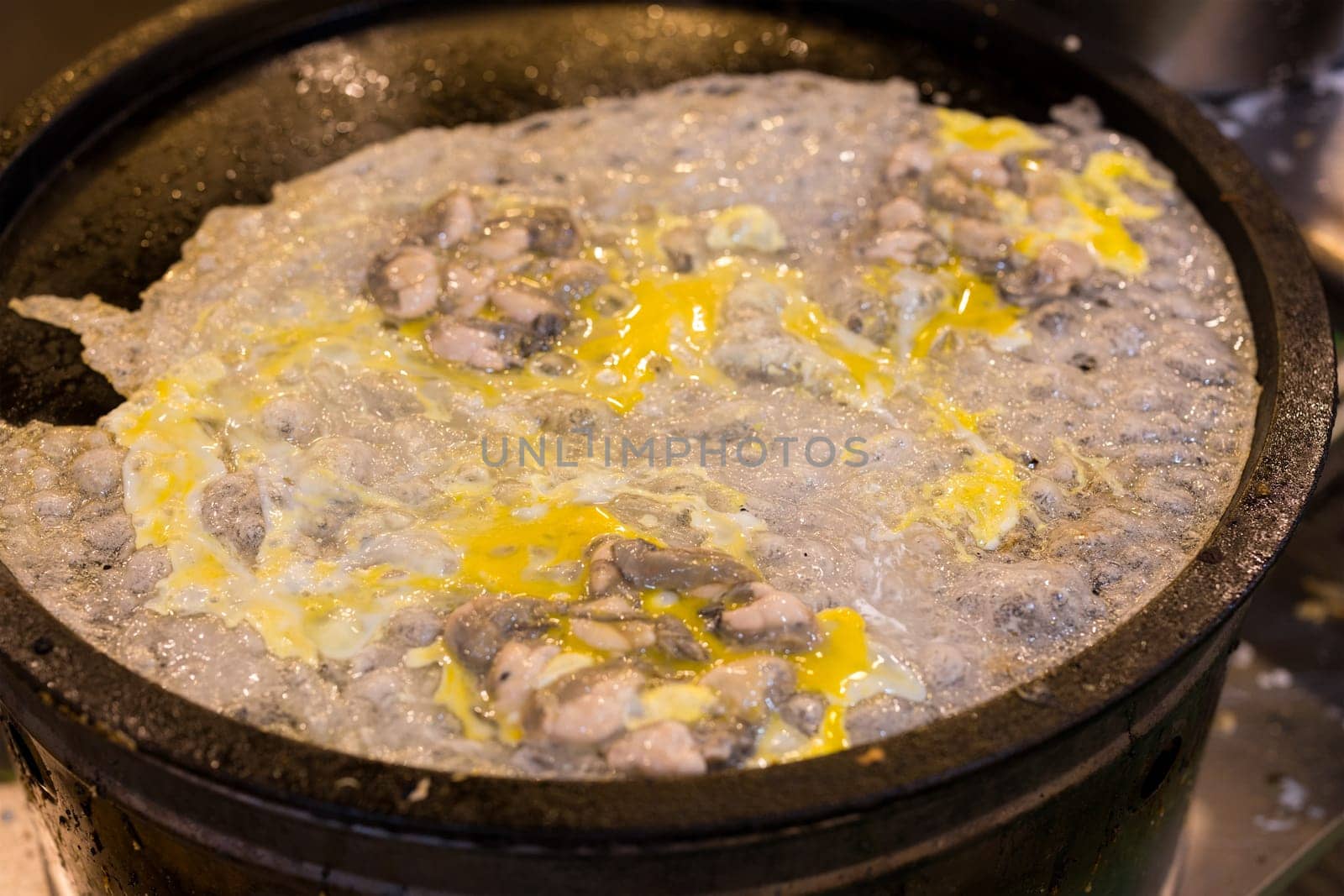 Cooking Taiwan famous Oyster omelette in local food store