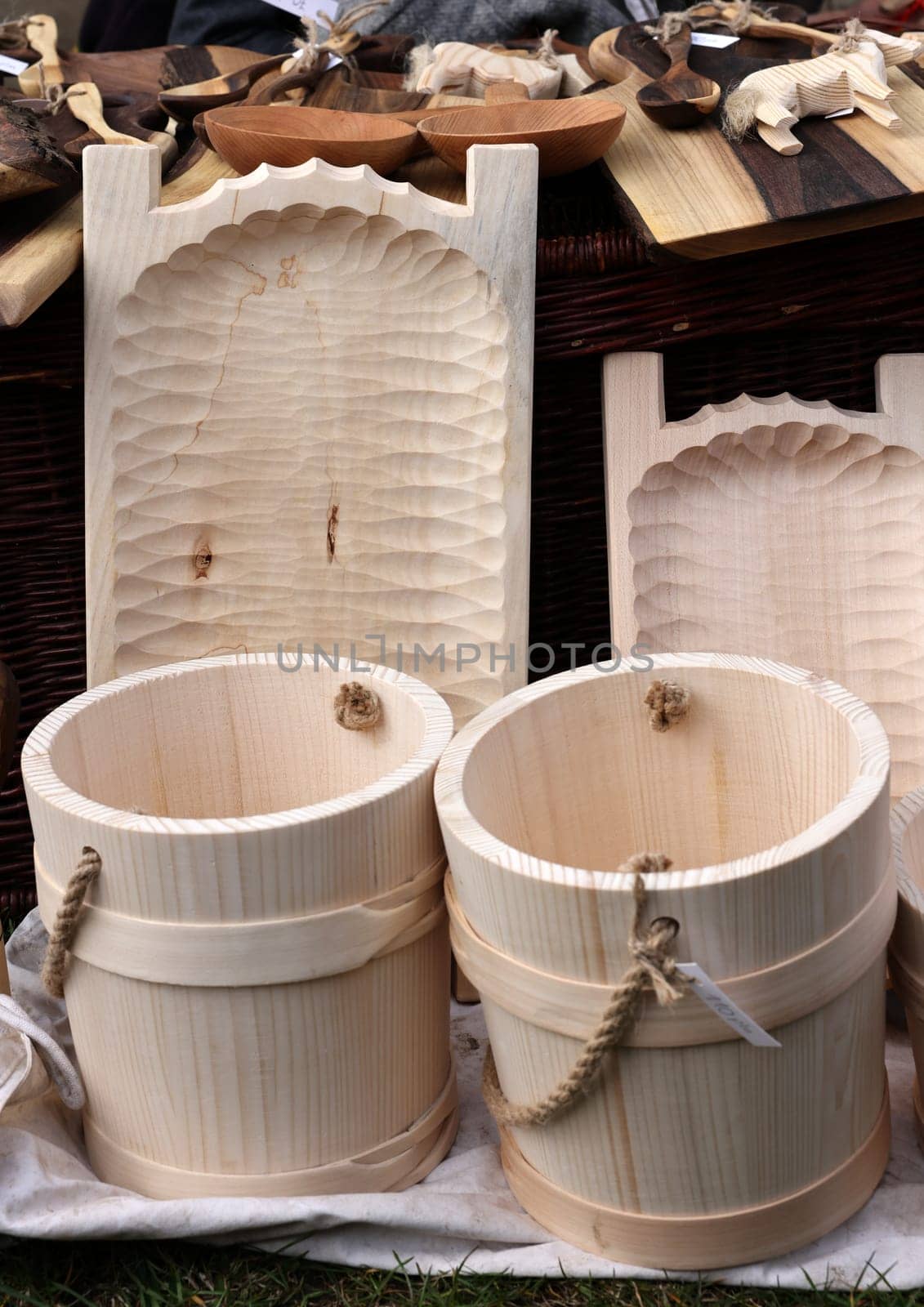 Cracow, Poland - April 11, 2023: Imitations of old wooden vessels in knight camp at the festival of historical reconstruction