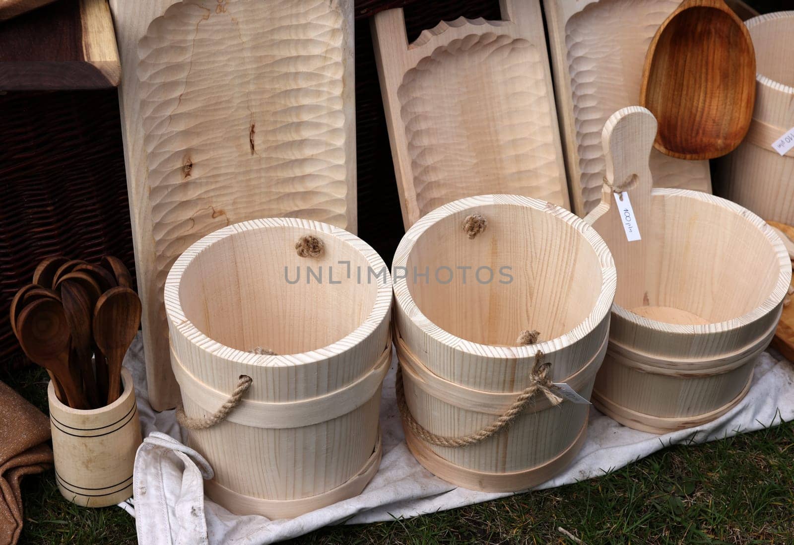 Cracow, Poland - April 11, 2023: Imitations of old wooden vessels in knight camp at the festival of historical reconstruction