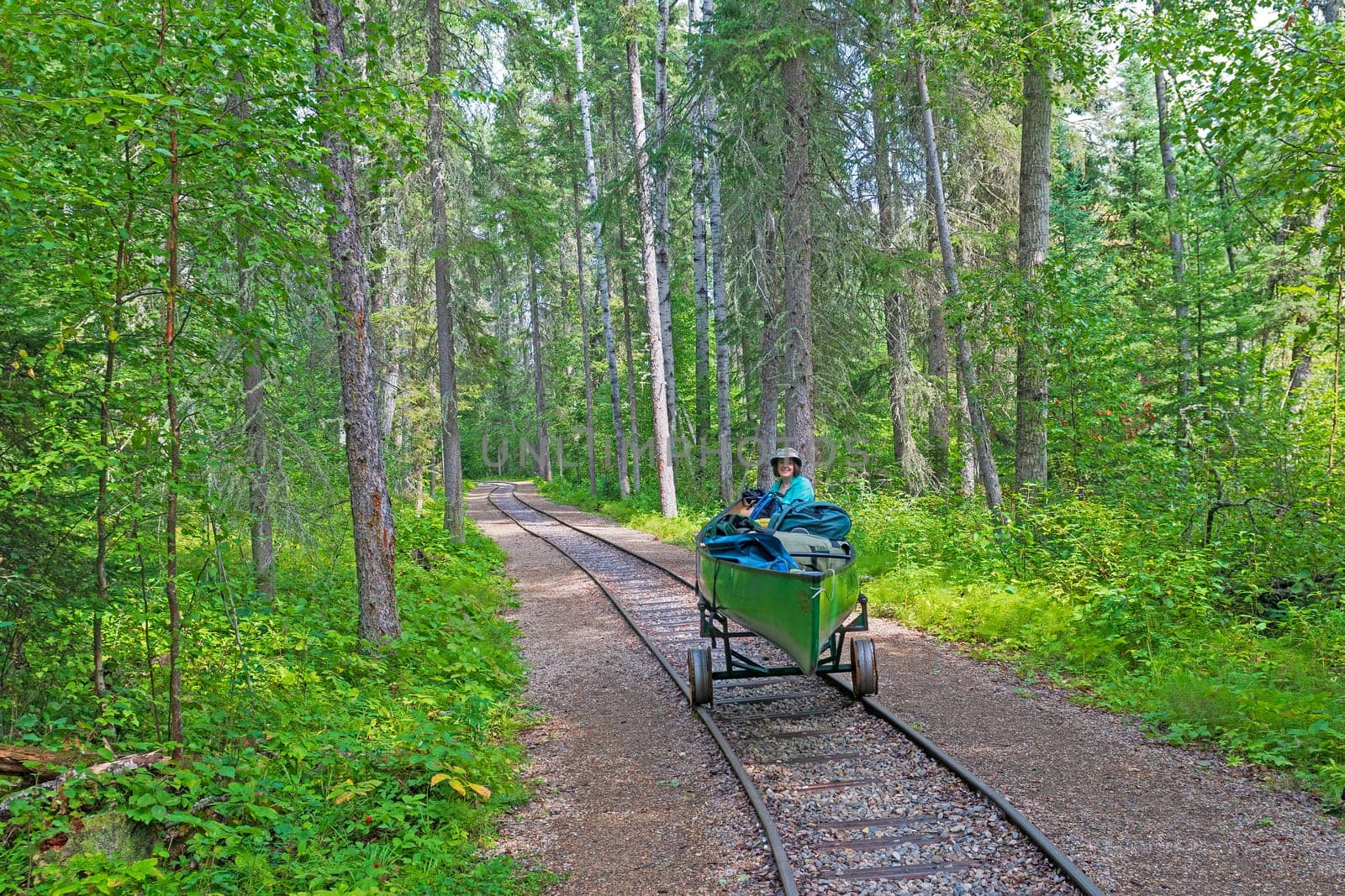 Portaging a Canoe on a Rail Portage in Prince Albert National Park in Saskatchewan