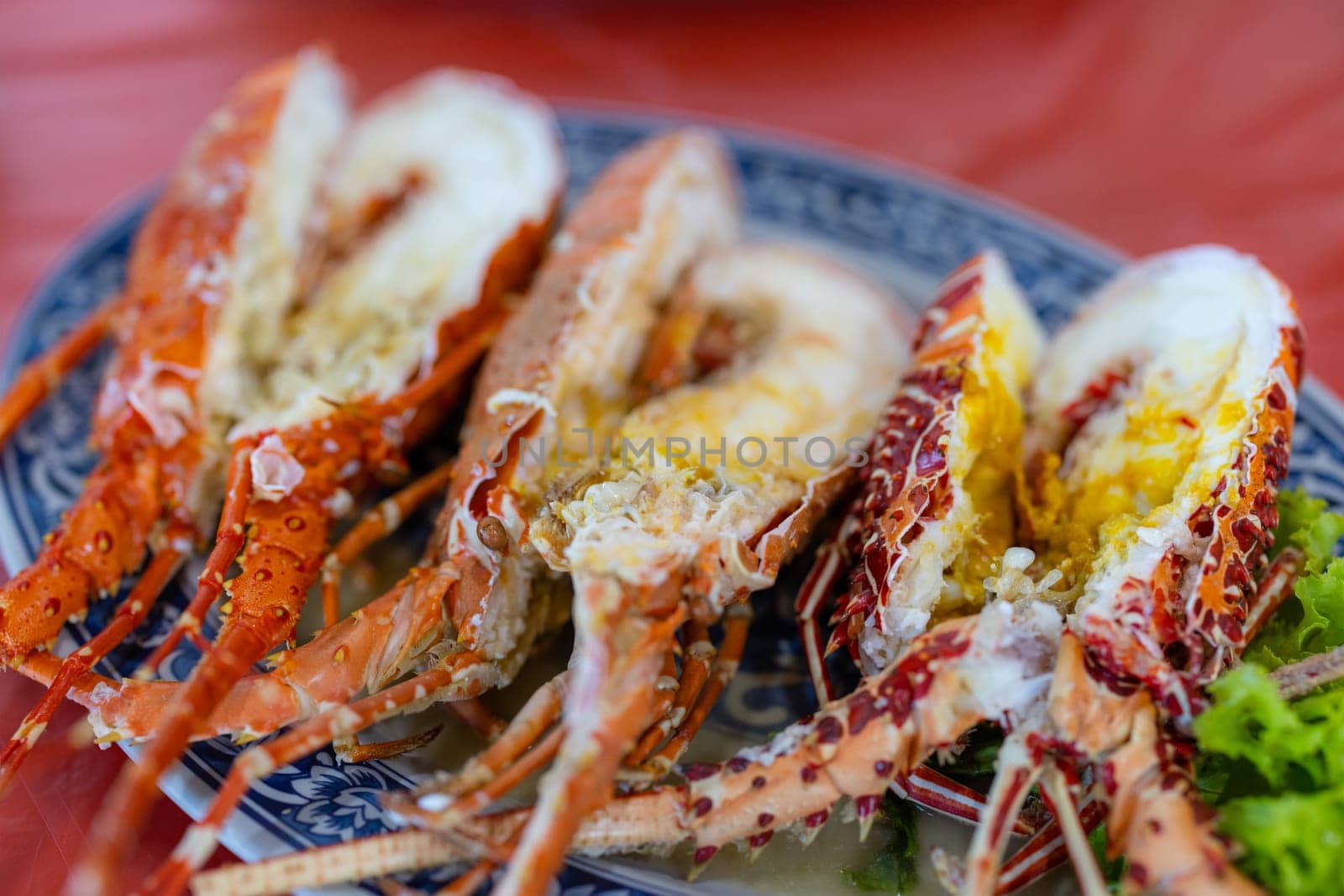 Steamed lobster in vegetable decoration