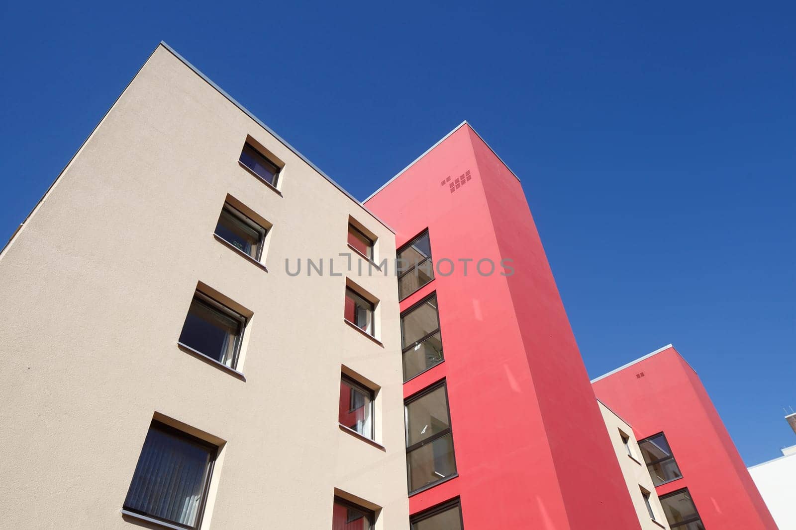 Modern, red and white residential building in spring, Findorff, Bremen, Germany