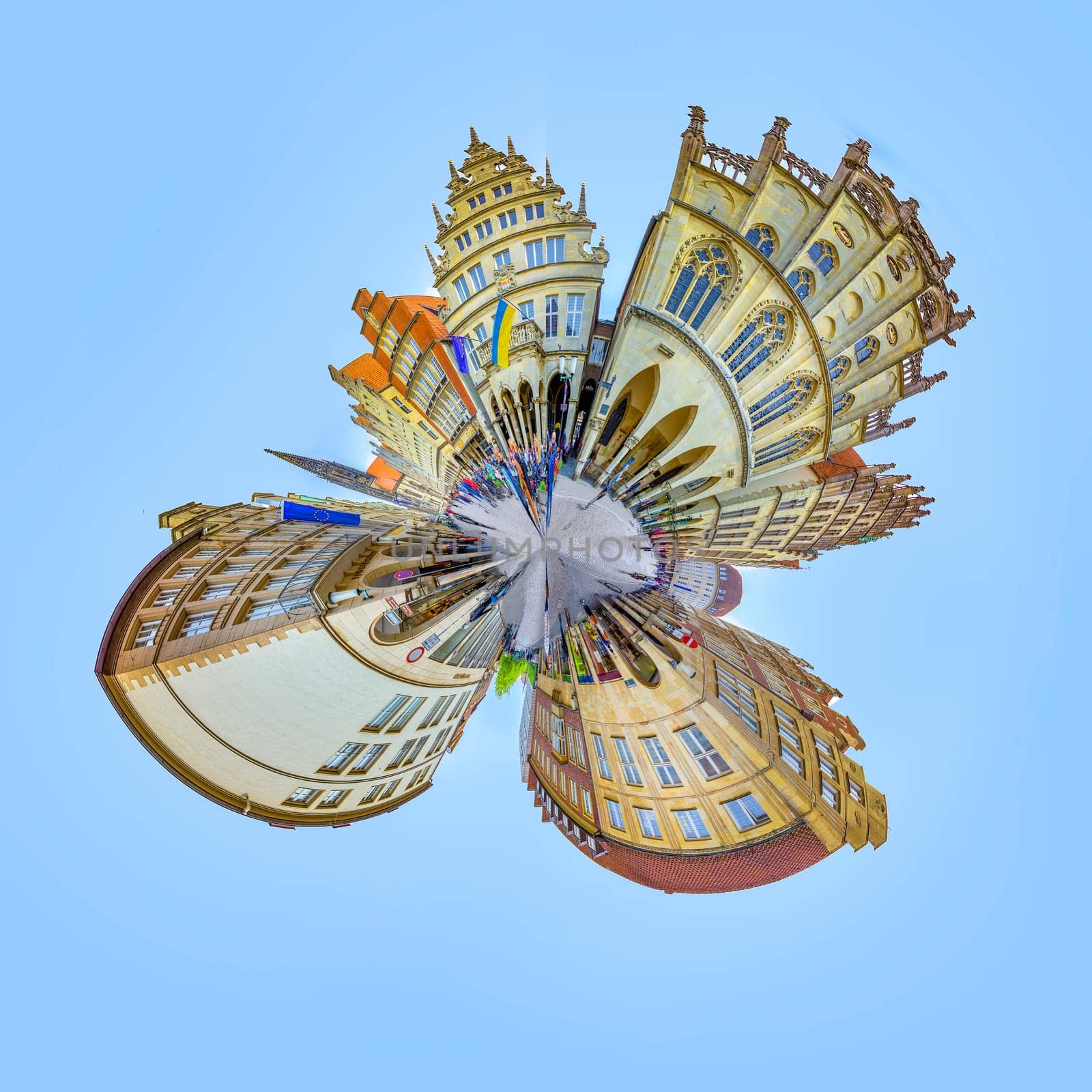 Muenster, Germany - April 29, 2022: scenic view to facade of old historic houses in panoramic view at the Prinzipal markt engl: square of the prince in Muenster in tiny planet style.