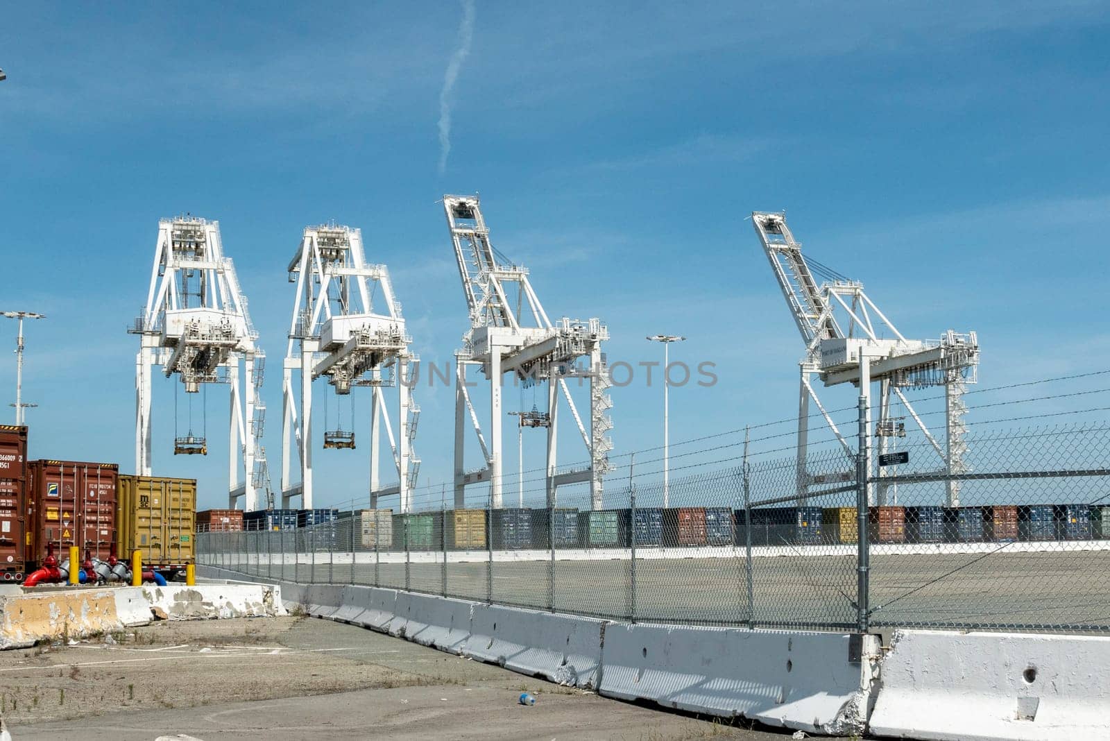 Oakland,USA - May 18, 2022: harbor cranes to carry containers at Oakland harbor, San Francisco, USA