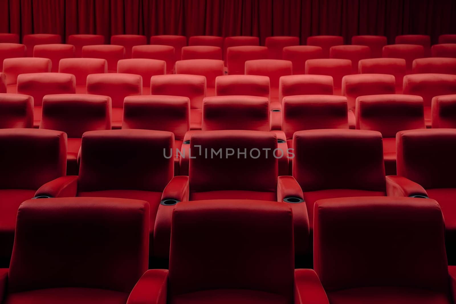Empty red seats in cinema, domestic intimacy, zoom in, up close. Neural network generated in January 2024. Not based on any actual scene or pattern.
