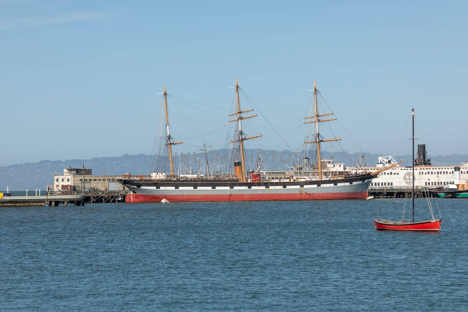 San Francisco, USA - May 18, 2022: panoramic view to Hyde pier in San Francisco with historic sailor Balclutha and other ships.