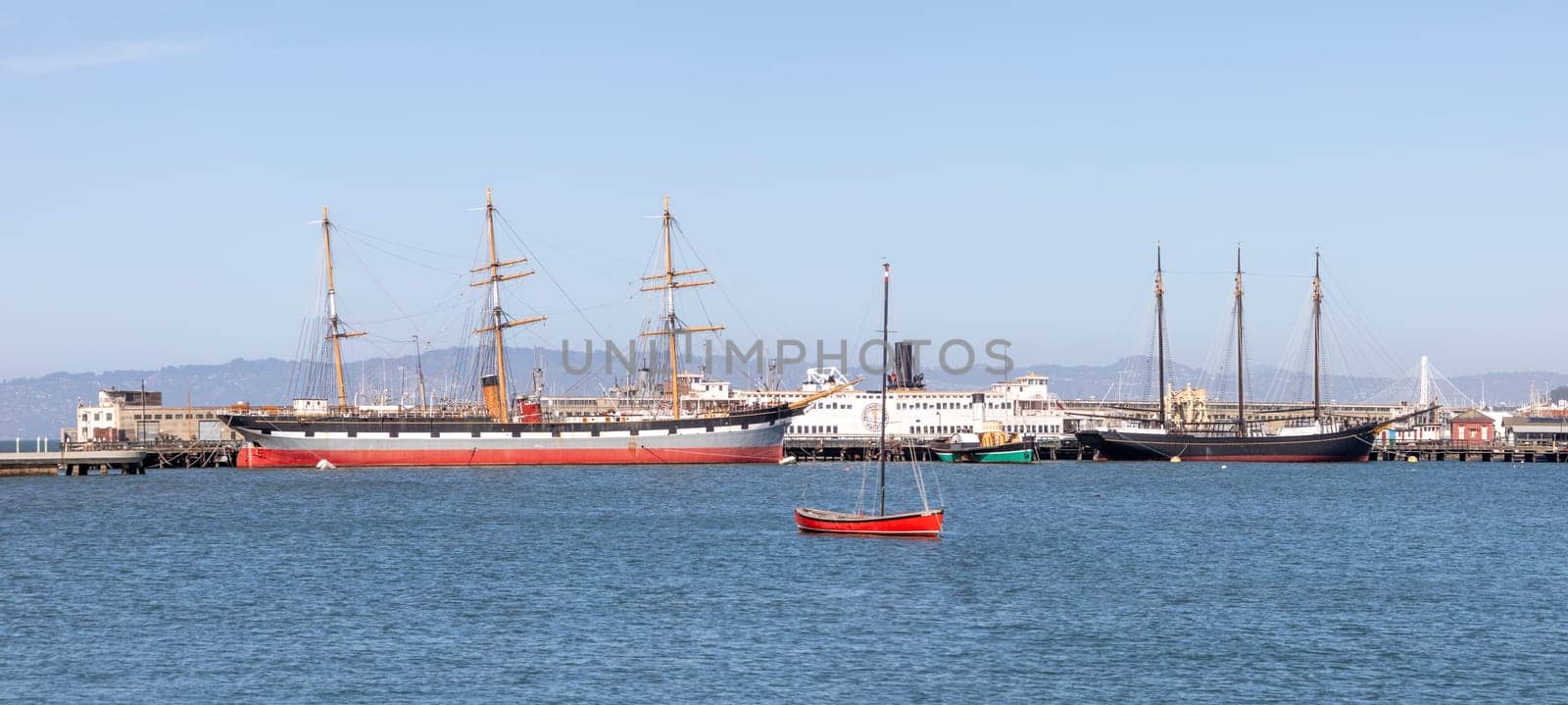 San Francisco, USA - May 18, 2022: panoramic view to Hyde pier in San Francisco with historic sailor Balclutha and other ships.