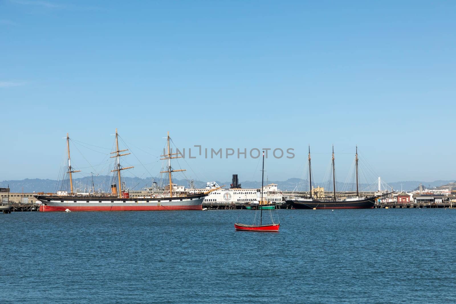 San Francisco, USA - May 18, 2022: view to fishermans wharf area in San Francisco with skyline and old traditional boats at Hyde street pier.