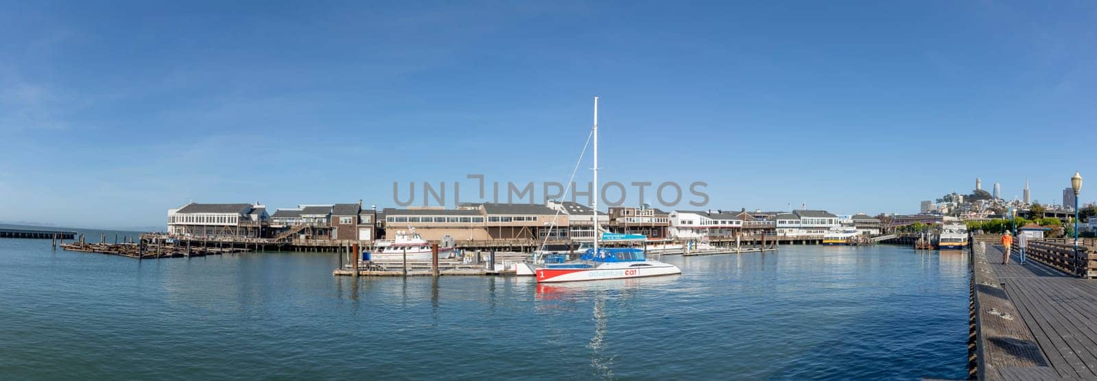 San Francisco, USA - May 18, 2022: sailing boats at the old historic pier 39 in San Francisco in early morning.