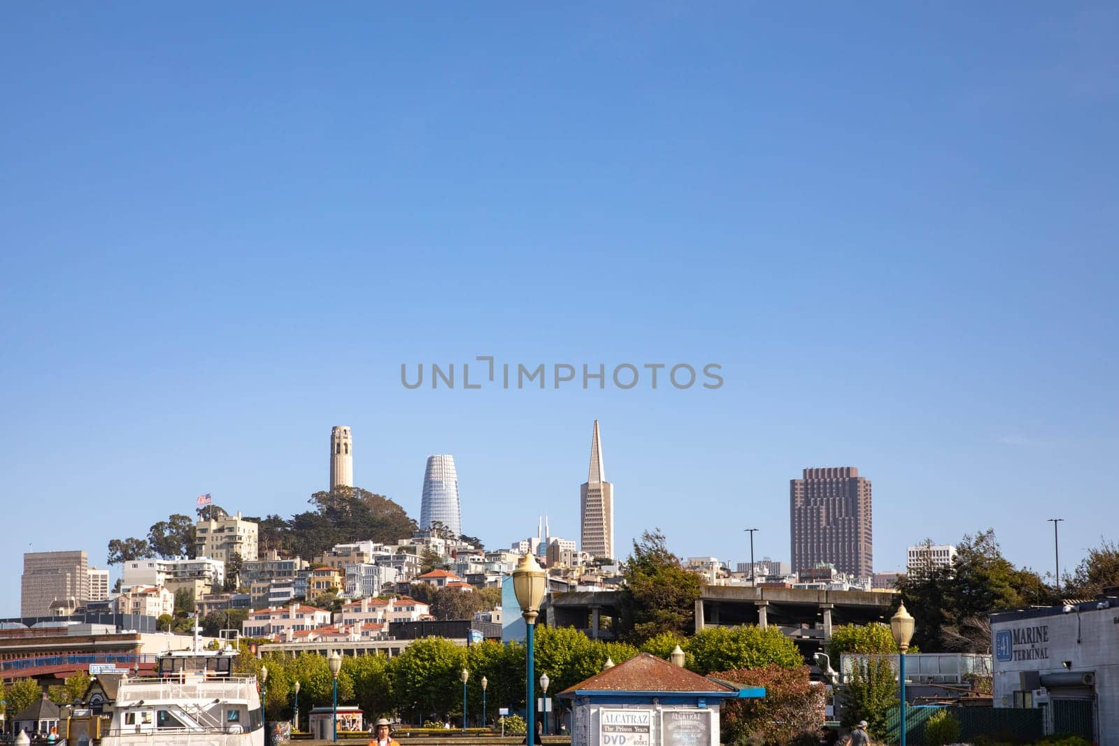 San Francisco, USA - May 18, 2022: skyline of San Francisco with skyscraper and pyramid in early morning light seen from pier 36.