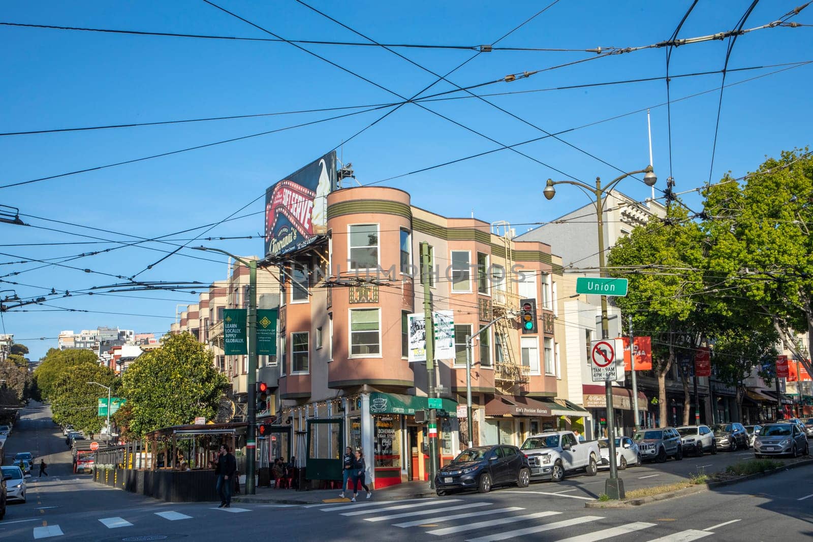 San Francisco, USA - May 18, 2022:  old houses in downtown San Francisco in bright light at Union street.