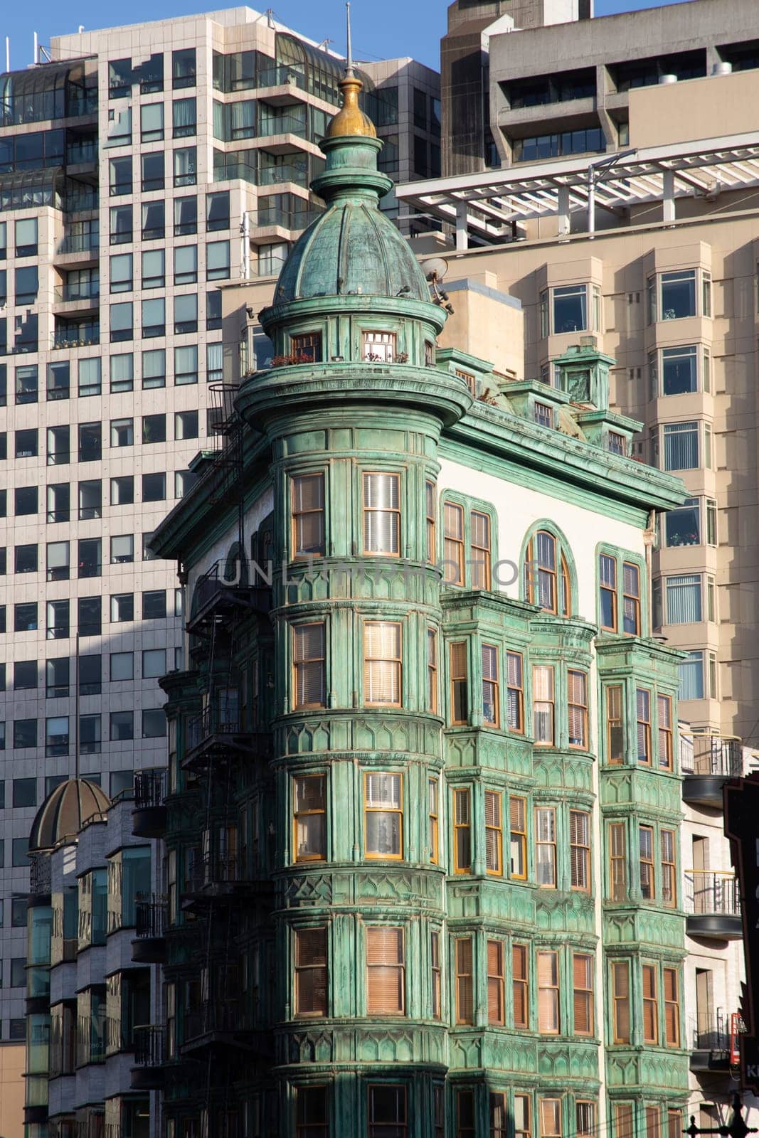San Francisco, USA - May 18, 2022: facade of Old copper-green Columbus tower also called sentinel building.