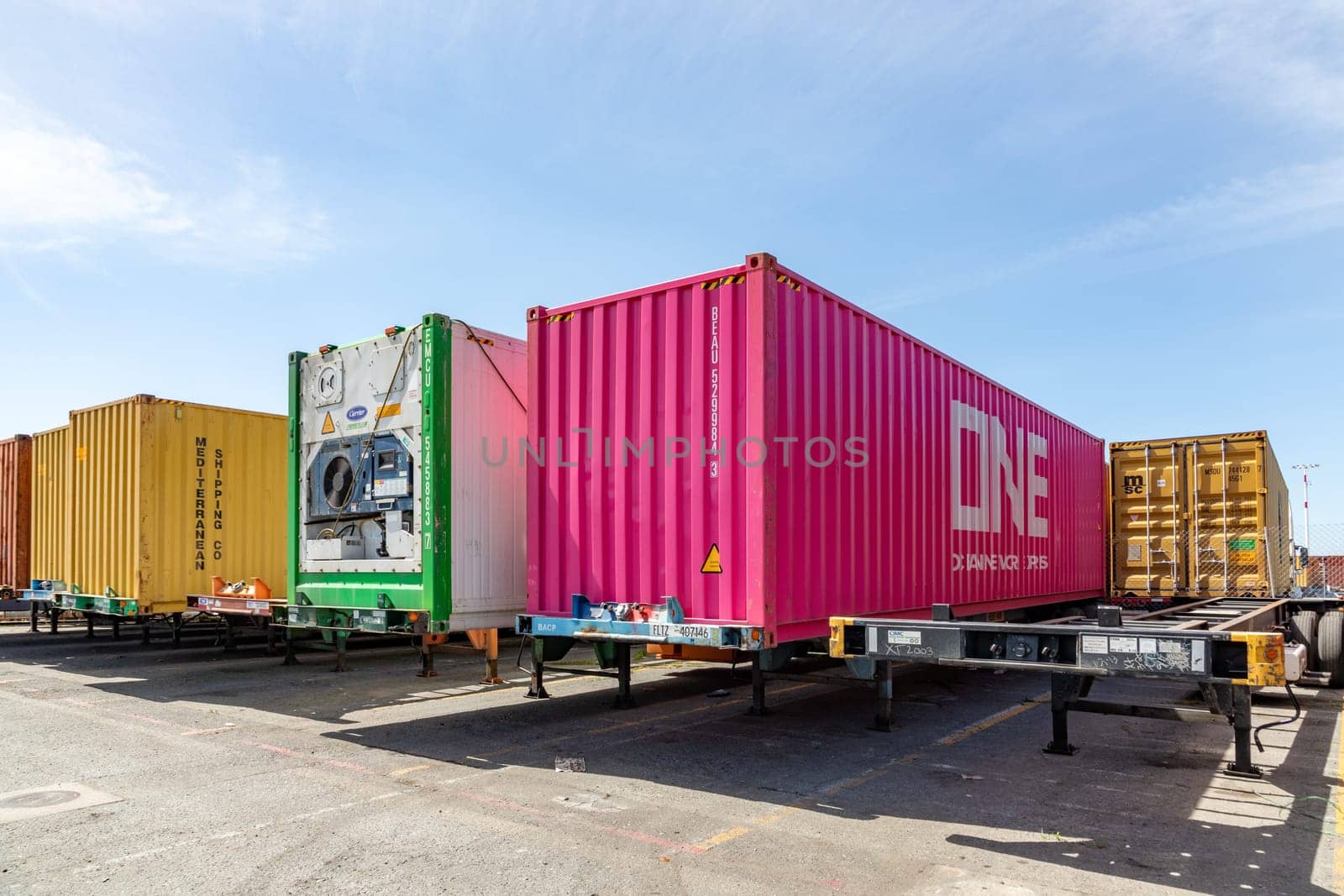 Oakland, USA - May 18, 2022: container at Oakland harbor in panoramic view. Oakland harbor serves San Francisco with goods.