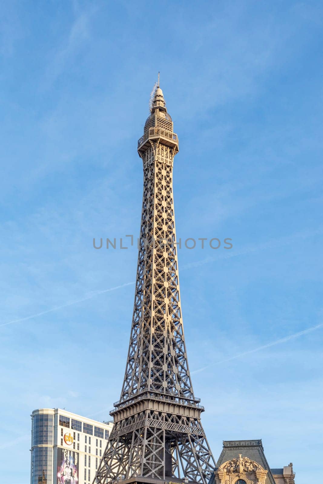 Las Vegas, USA - May 23, 2022:  Eiffel Tower and city hotels along The Strip on a sunny day.