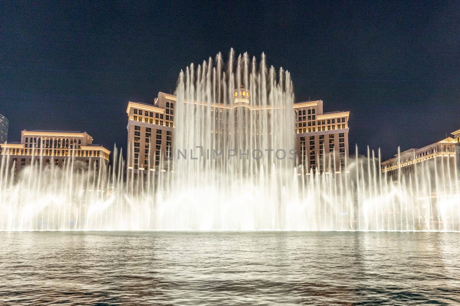 Las Vegas, Nevada, USA -May 23, 2022 : The Fountains of Bellagio at night. This feature performs choreography with water, music and light in front of the Bellagio hotel and casino.