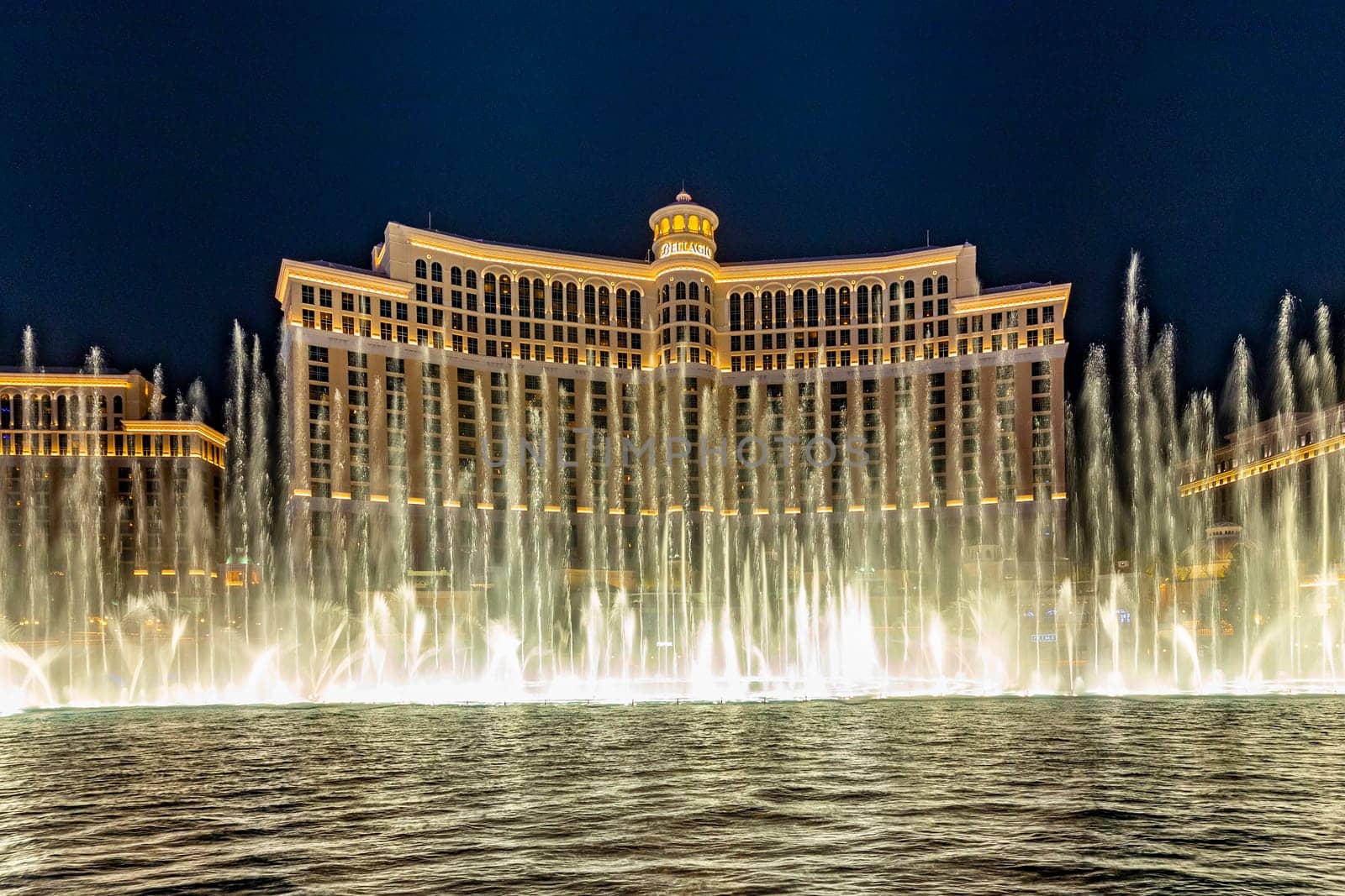 Las Vegas, Nevada, USA -May 23, 2022 : The Fountains of Bellagio at night. This feature performs choreography with water, music and light in front of the Bellagio hotel and casino.