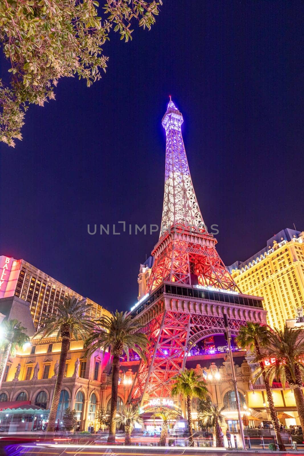 Las Vegas, USA - May 23, 2022:  Eiffel tower in neon light in the evening in Las Vegas.  It is a half scale, 540-foot (164.6 m) tall replica of the Eiffel Tower in Paris.