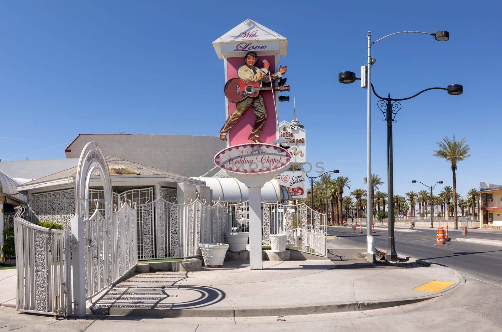 Las Vegas, USA - May 24, 2022:    sign wedding chapel with picture of Elvis Presley and the little white chapel in background for fast marriages.