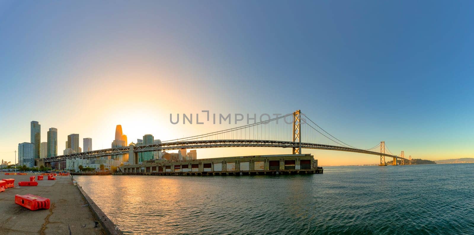 San Francisco, USA - June 6, 2022: view to Bay bridge in San Francisco in sunset  mood with skyline.
