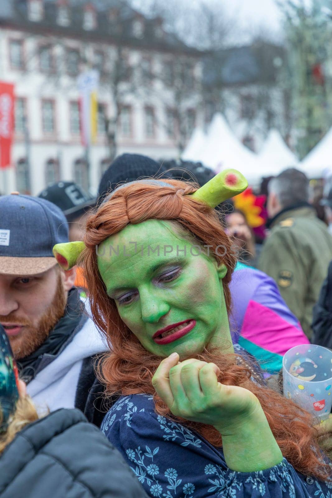 Mainz, Germany - February 16, 2023: people celebrate the Weiberfastnacht - engl womans carnival - in Mainz at the schiller square in Germany.