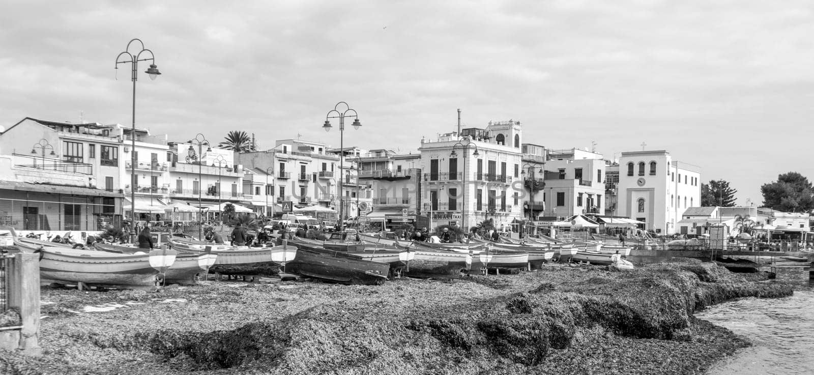 Modello, Italy - February 11, 2023: fishermens boats at the beach  in the center of Mondello.