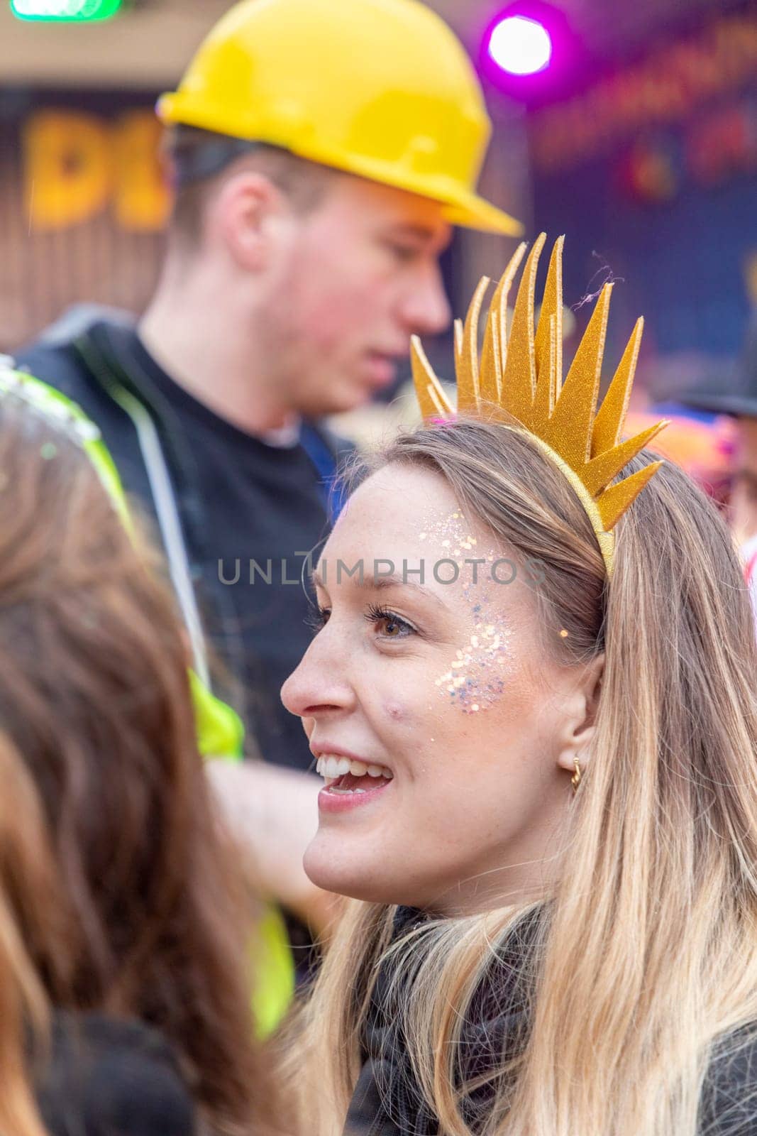 Mainz, Germany - February 16, 2023: people celebrate the Weiberfastnacht - engl womans carnival - in Mainz at the schiller square in Germany.