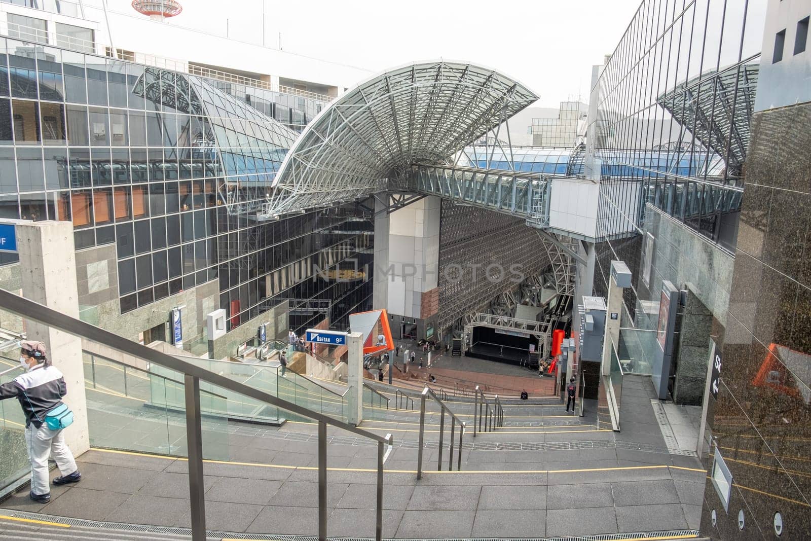 Kyoto, Japan - March 25, 2023: View of Kyoto railway station from the Grand Stairway or Daikaidan. Kyoto. Japan