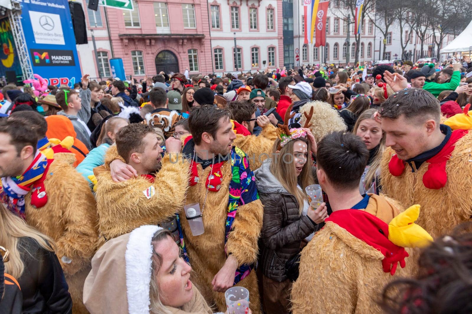 Mainz, Germany - February 16, 2023: people celebrate the Weiberfastnacht - engl womans carnival - in Mainz at the schiller square in Germany.