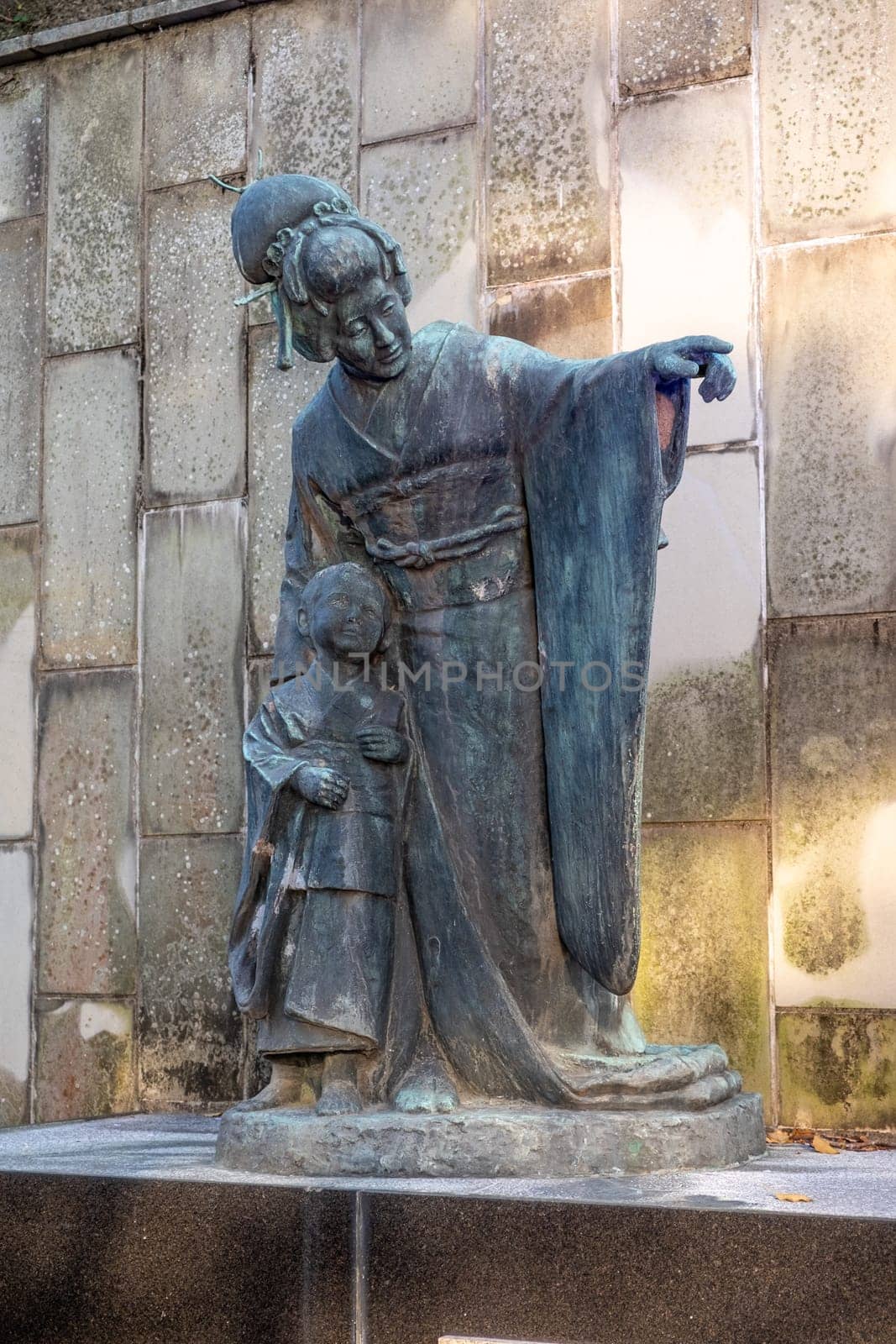Nagasaki, Japan - April 1, 2023: statue of Tamaki Miura, a Japanese opera singer who performed as Cio-Cio-San in Puccini's Madame Butterfly, in Glover Garden in Nagasaki, Japan.