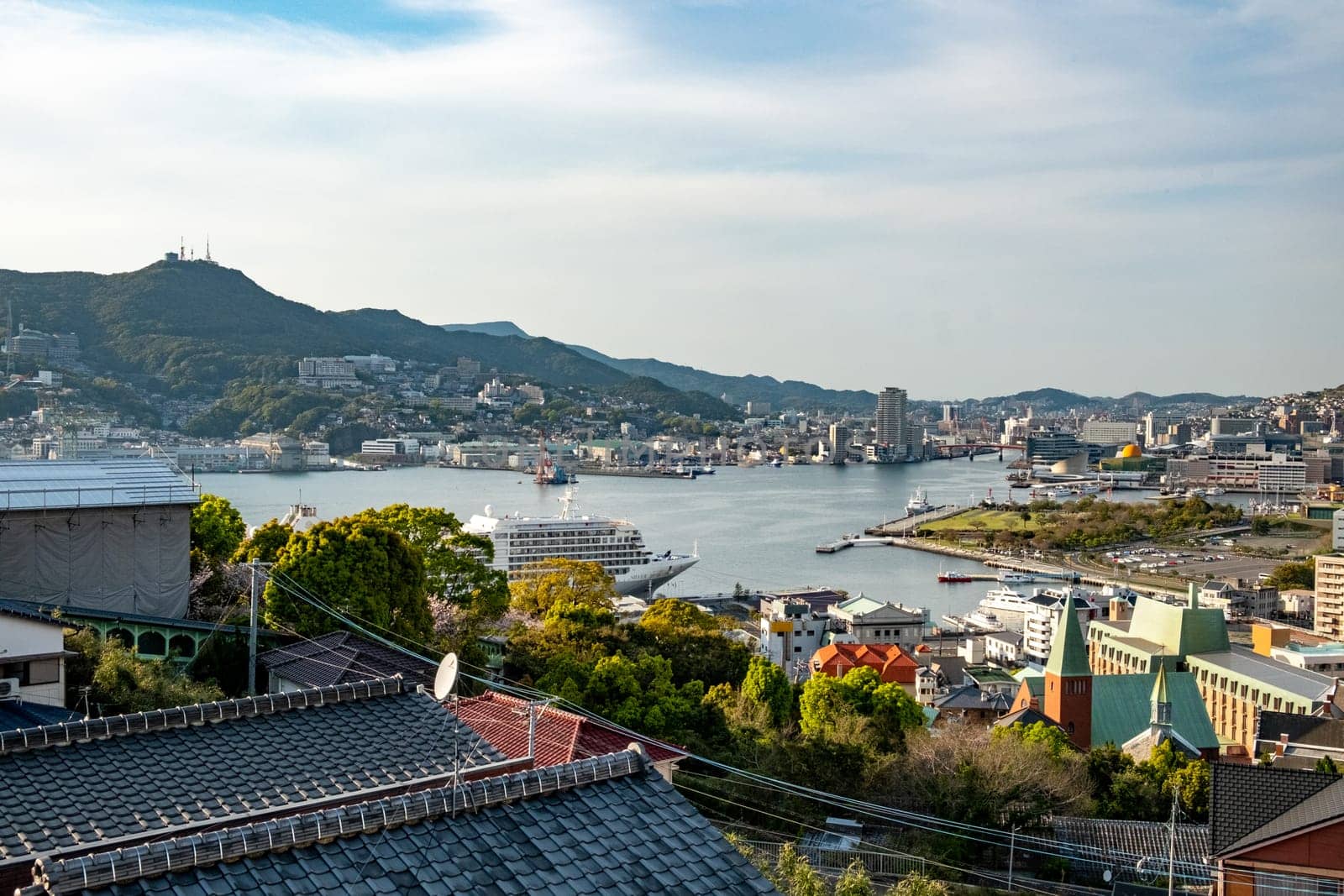 Nagasaki, Japan - April 1, 2023: view to skyline of Nagasaki with harbor seen from Glover garden