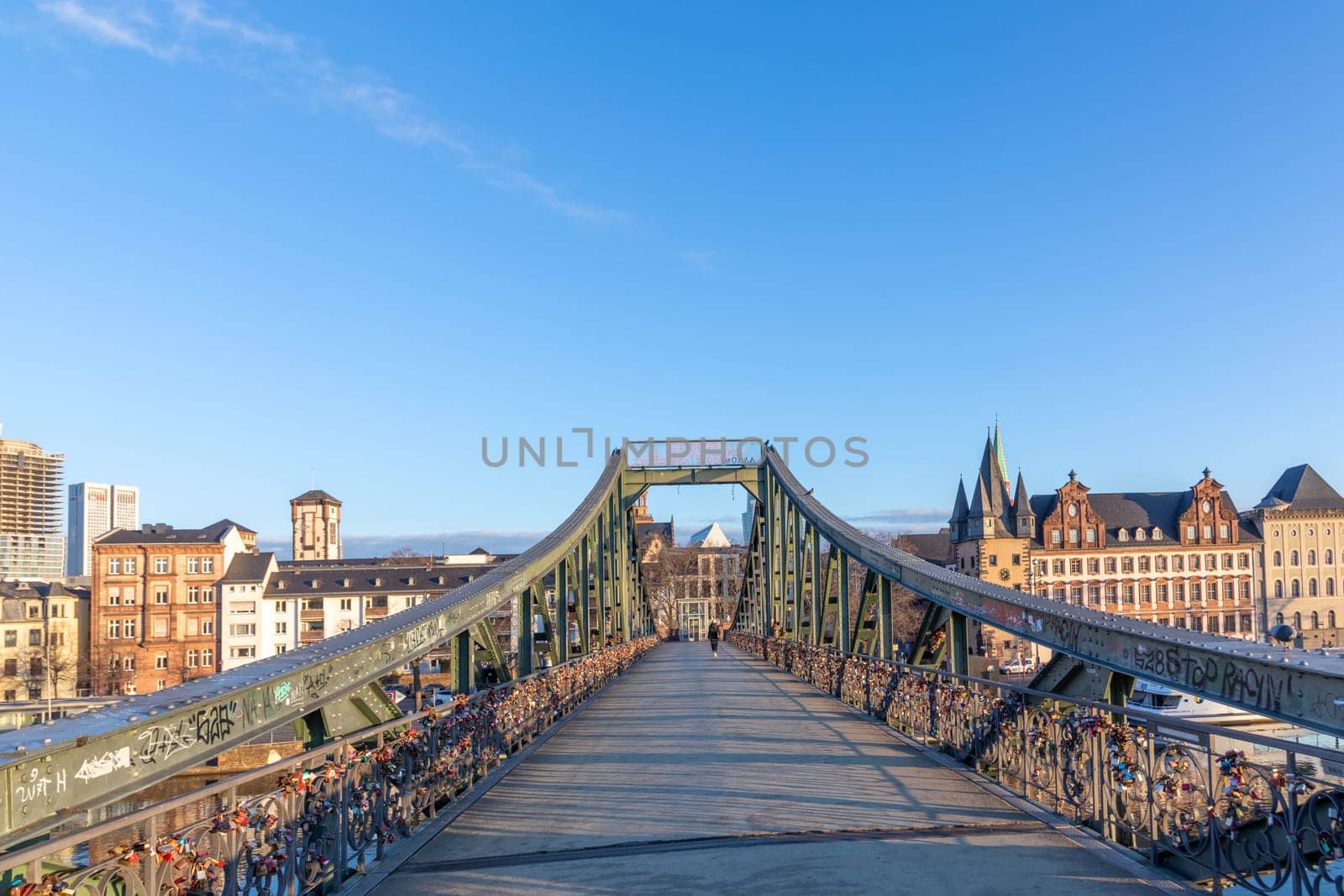 Frankfurt, Germany - February 28, 2023: view to skyline of Frankfurt from pedestrian bridge Eiserner Steg - engl:  iron Bridge, Germany