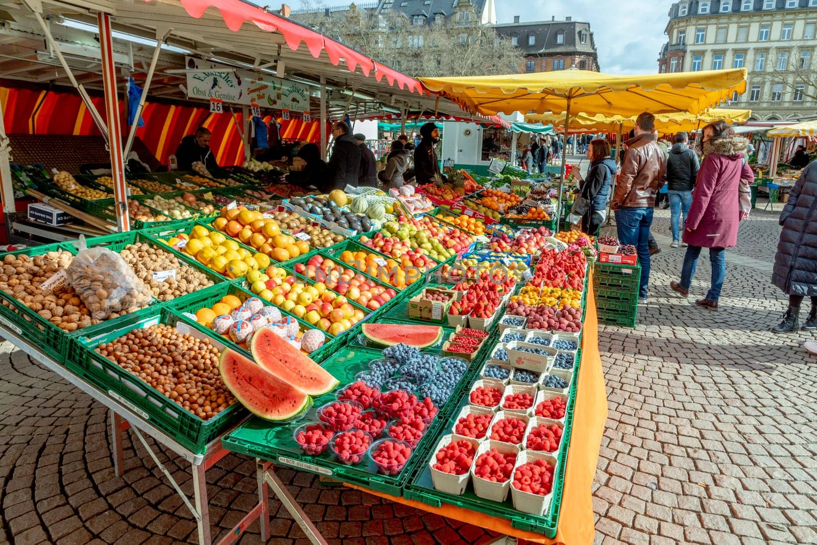 Wiesbaden, Germany - February 25, 2023: farmers sell fresh vegetables and fruits at the farmers market in Wiesbaden to local people.