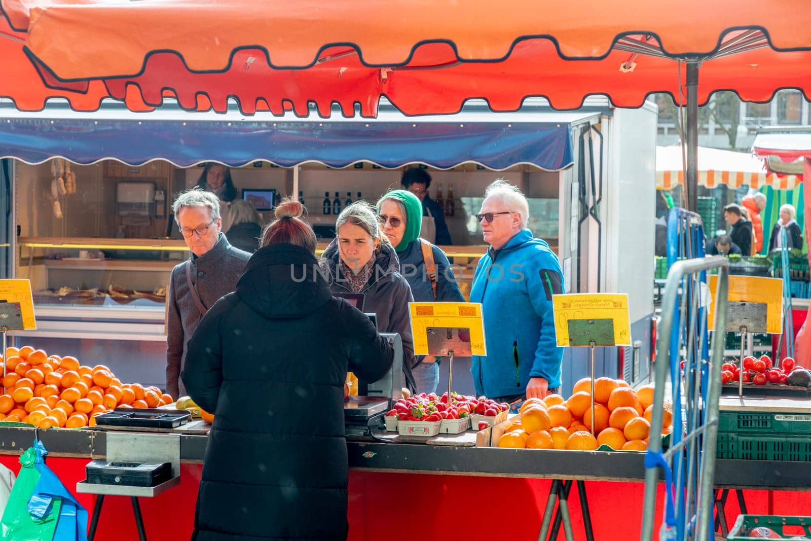 Wiesbaden, Germany - February 25, 2023: farmers sell fresh vegetables and fruits at the farmers market in Wiesbaden to local people.