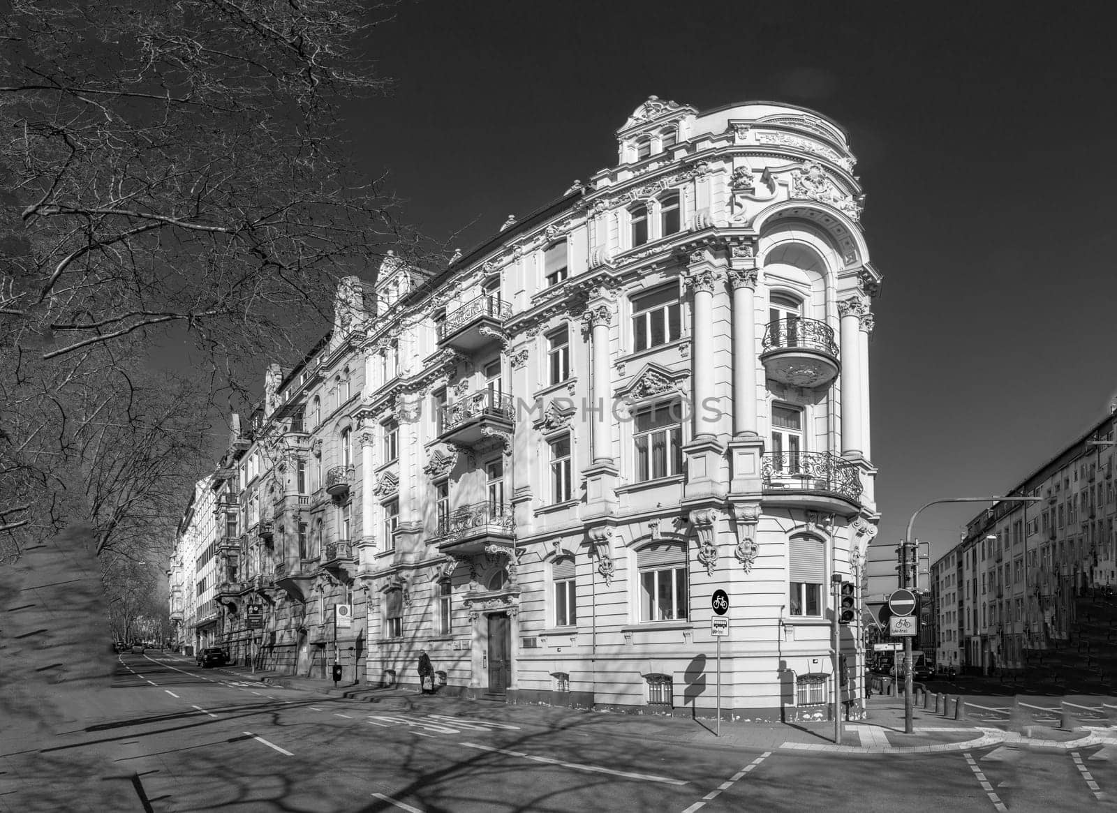 Wiesbaden, Germany - March 2, 2023: people at Kaiser Friedrich Ring - engl: King Friedrich circle - with its old scenic facade of the 19th century in classicistic and Art Nouveau style.
