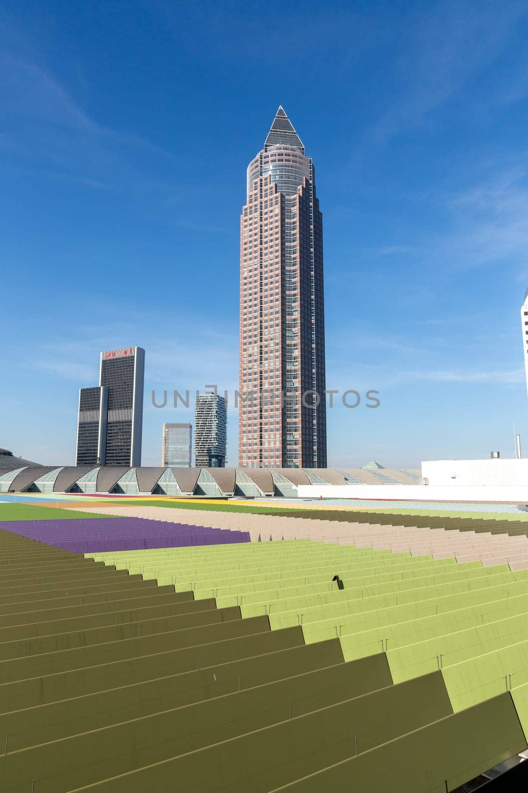 Frankfurt, Germany - March 3, 2023: skyline of Frankfurt with its skyscraper and Messeturm seen from platform of skyline plaza.