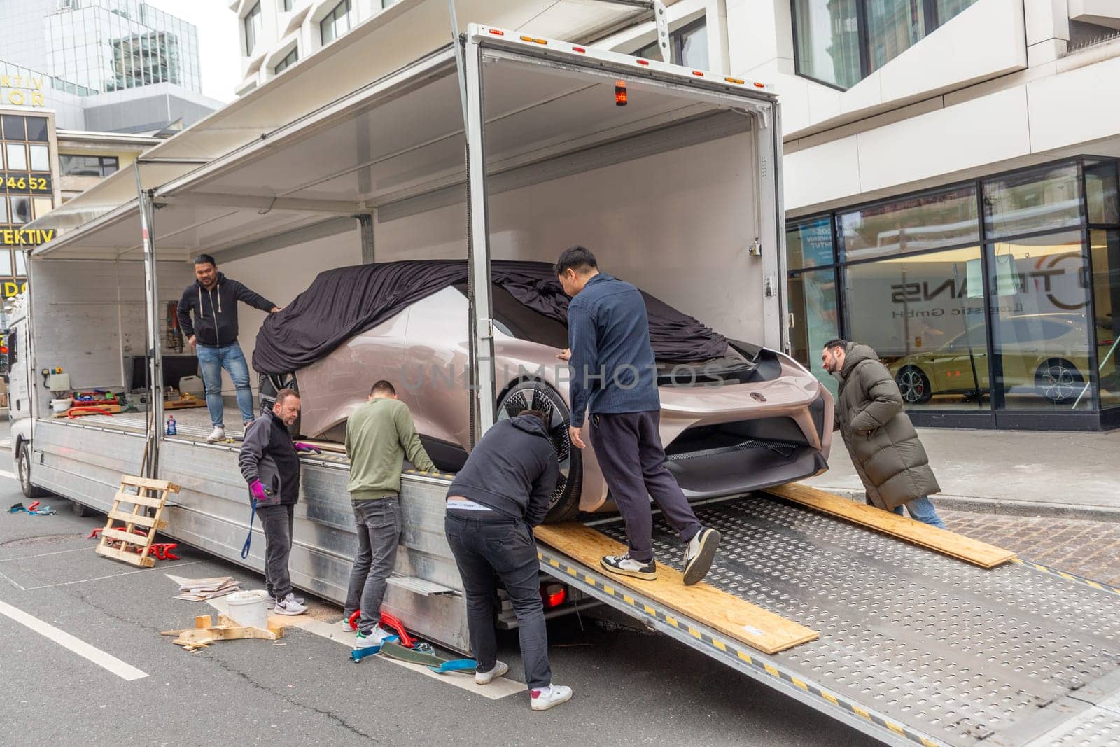 Frankfurt, Germany - March 21, 2023: NIO EVE Concept Self-driving Electric Car  is unloaded from a van to be placed in NIO showroom in Frankfurt.