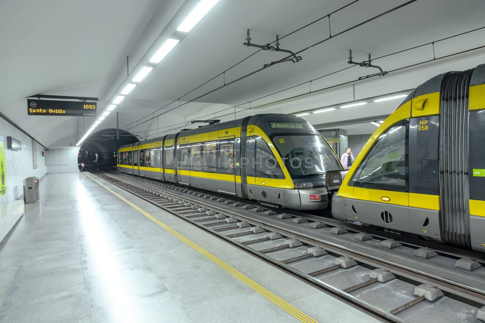 Porto, Portugal - May 3, 2023: metro stops at metro station faria guimaraes with modern metro in Porto, Portugal.